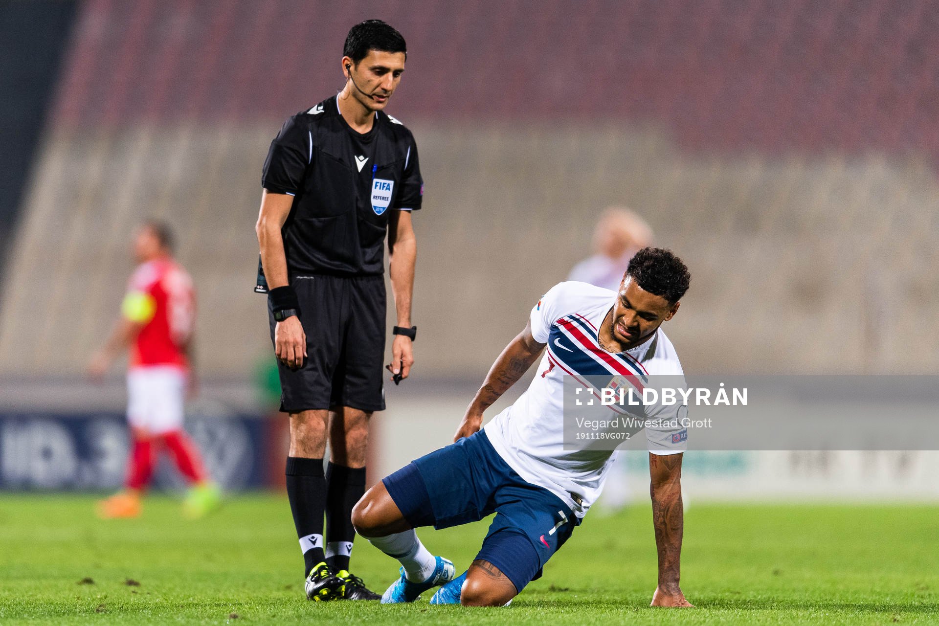 Referee Aliyar Aghayev see Joshua King of Norway sit down