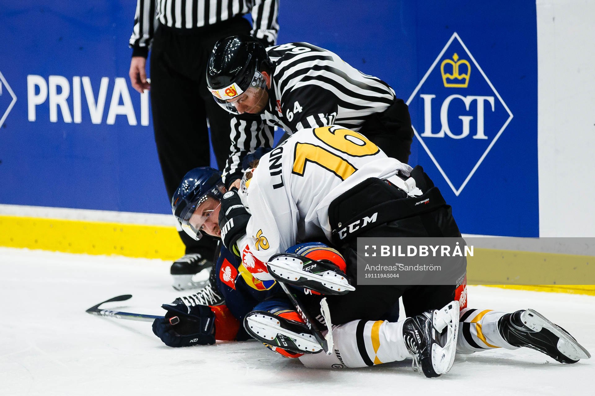 Linus Lindström of Skellefteå fights Marcus Högström of