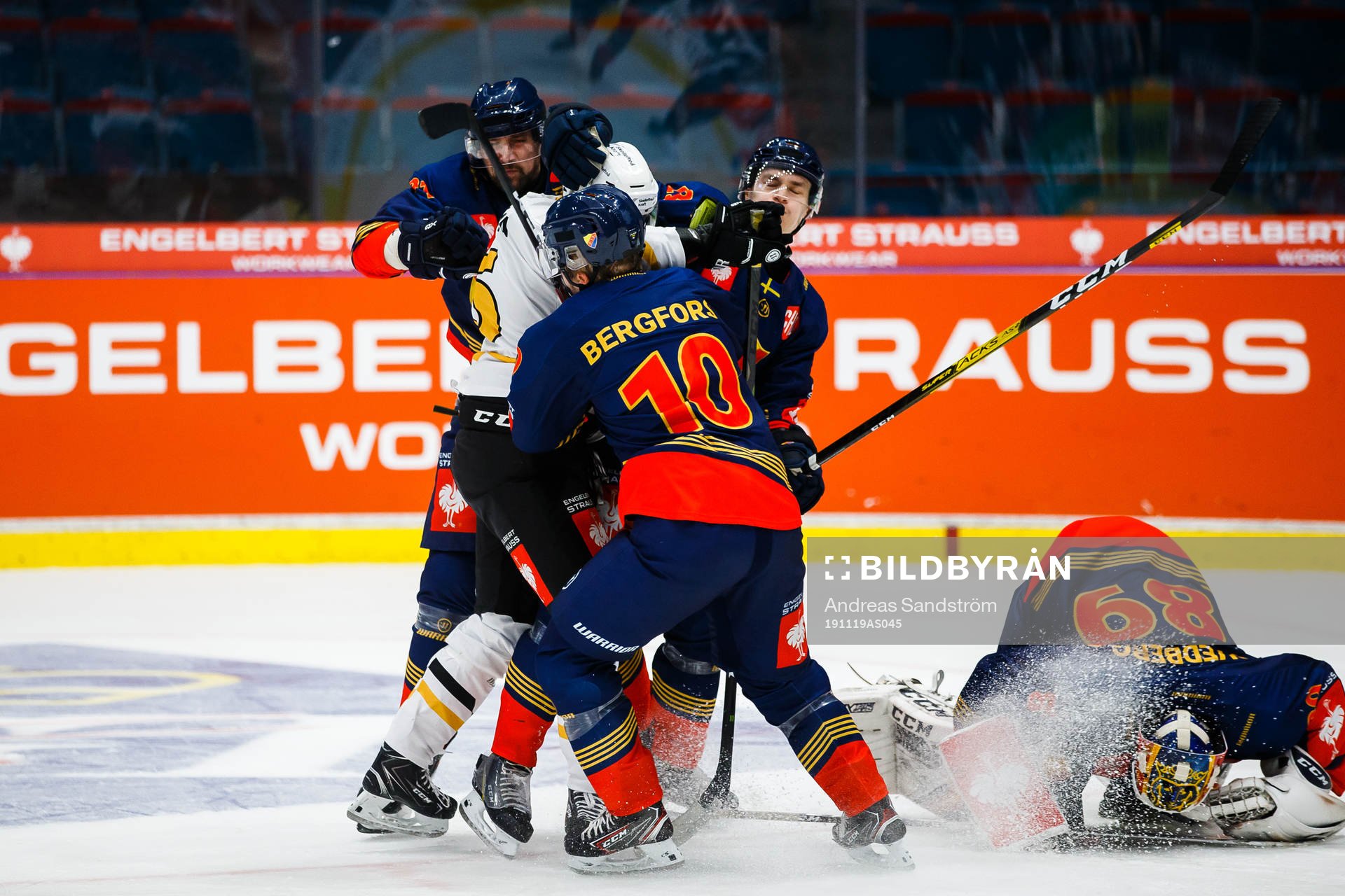 Linus Lindström of Skellefteå fights Patrik Berglund and