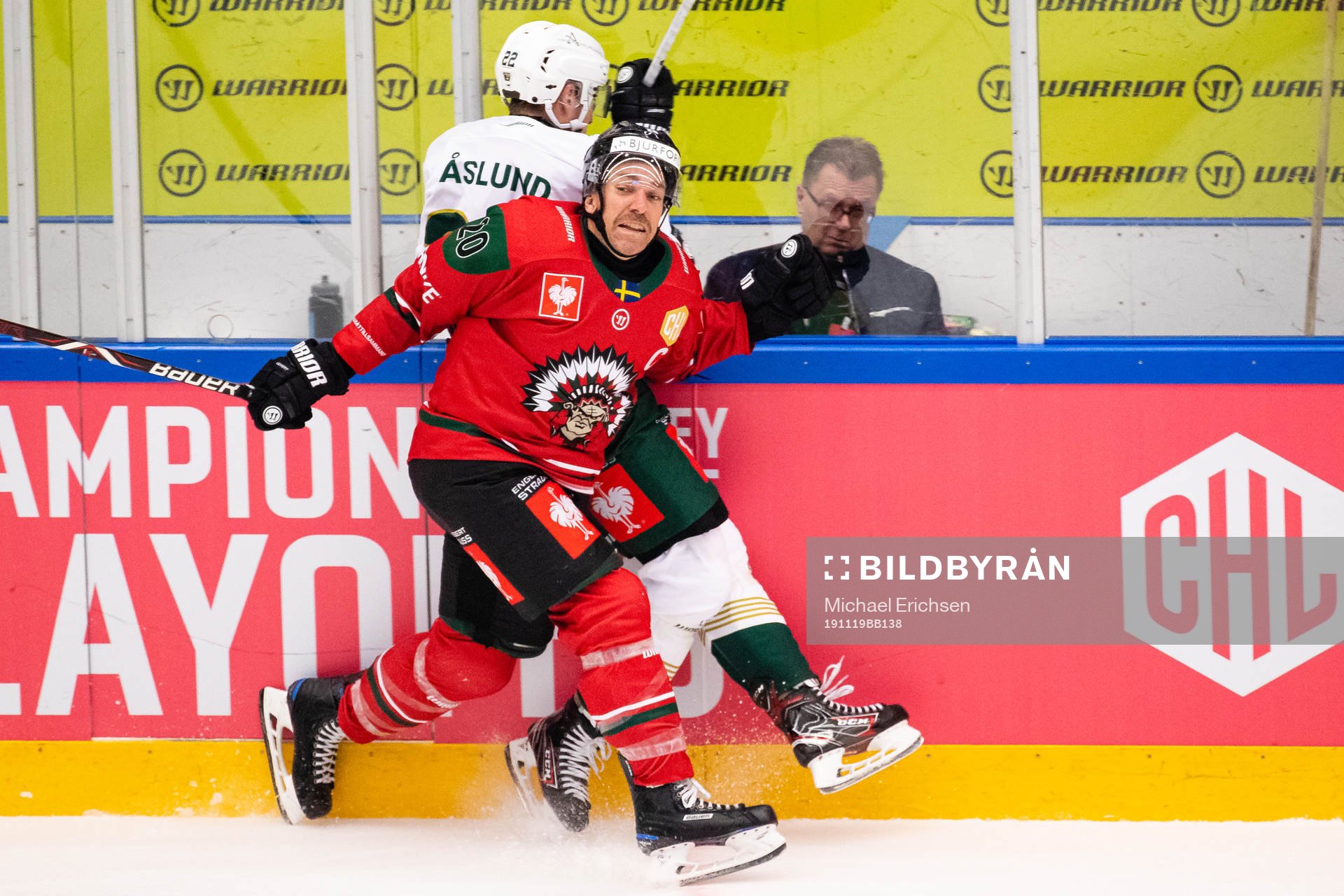 Joel Lundqvist of Frölunda hits Per Åslund of Färjestad