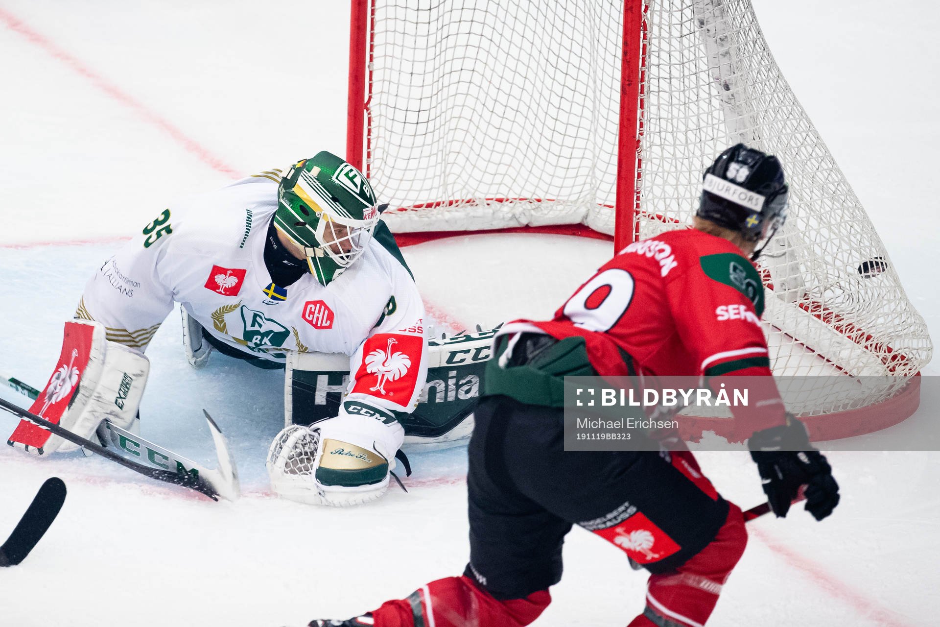 Simon Hjalmarsson of Frölunda scores 2-0 behind goalkeeper