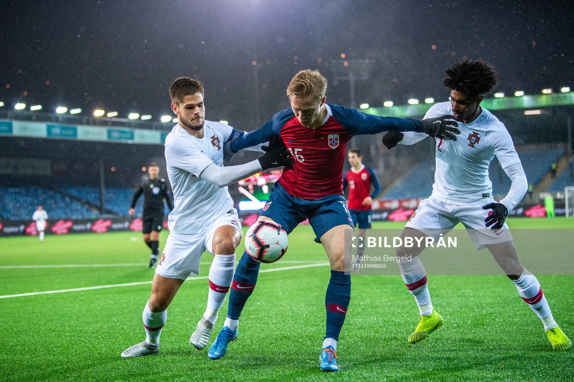 Ola Brynhildsen of Norway against Diogo Queiros and Thierry