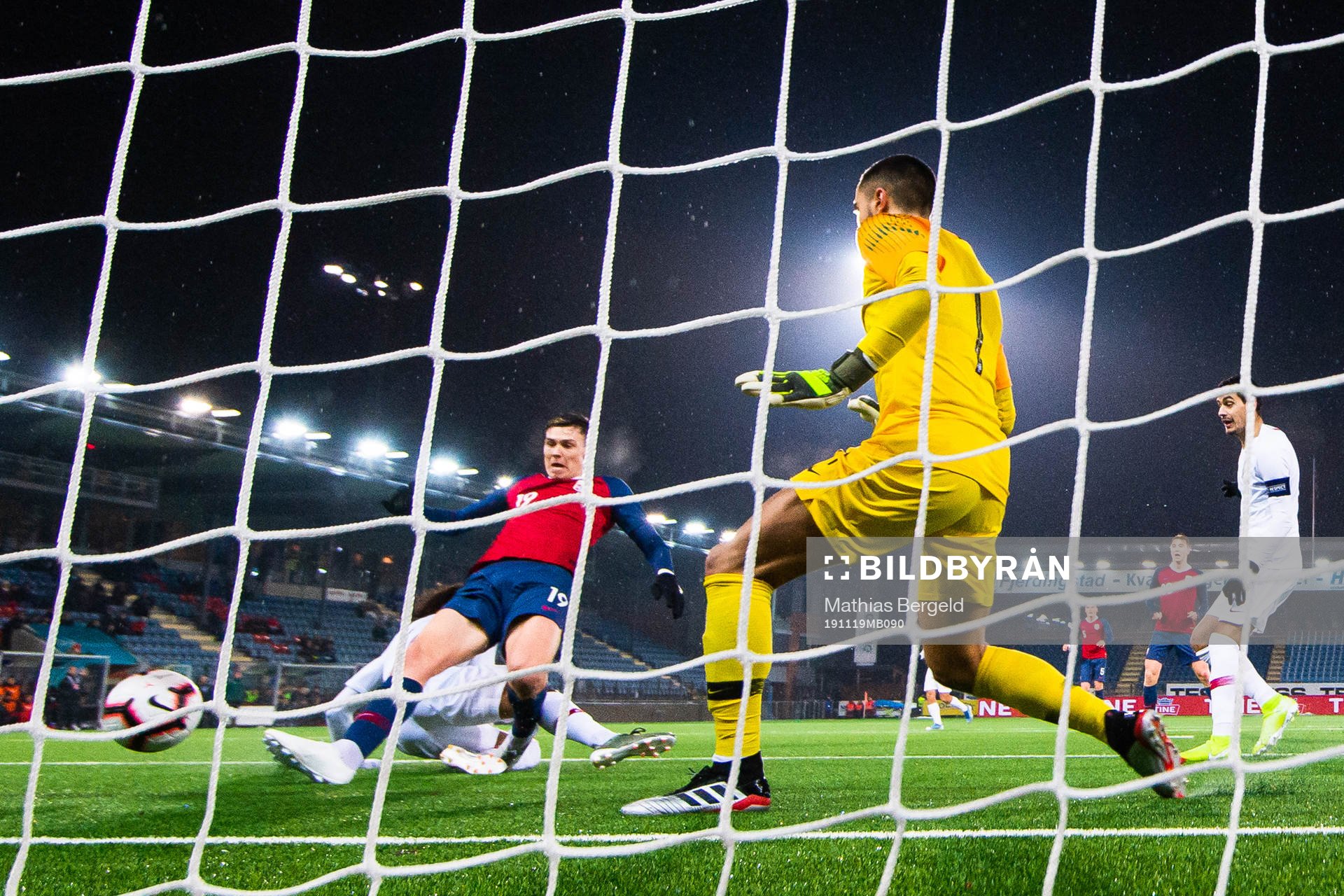 Jørgen Larsen of Norway scores 2-3 behind goalkeeper Diogo