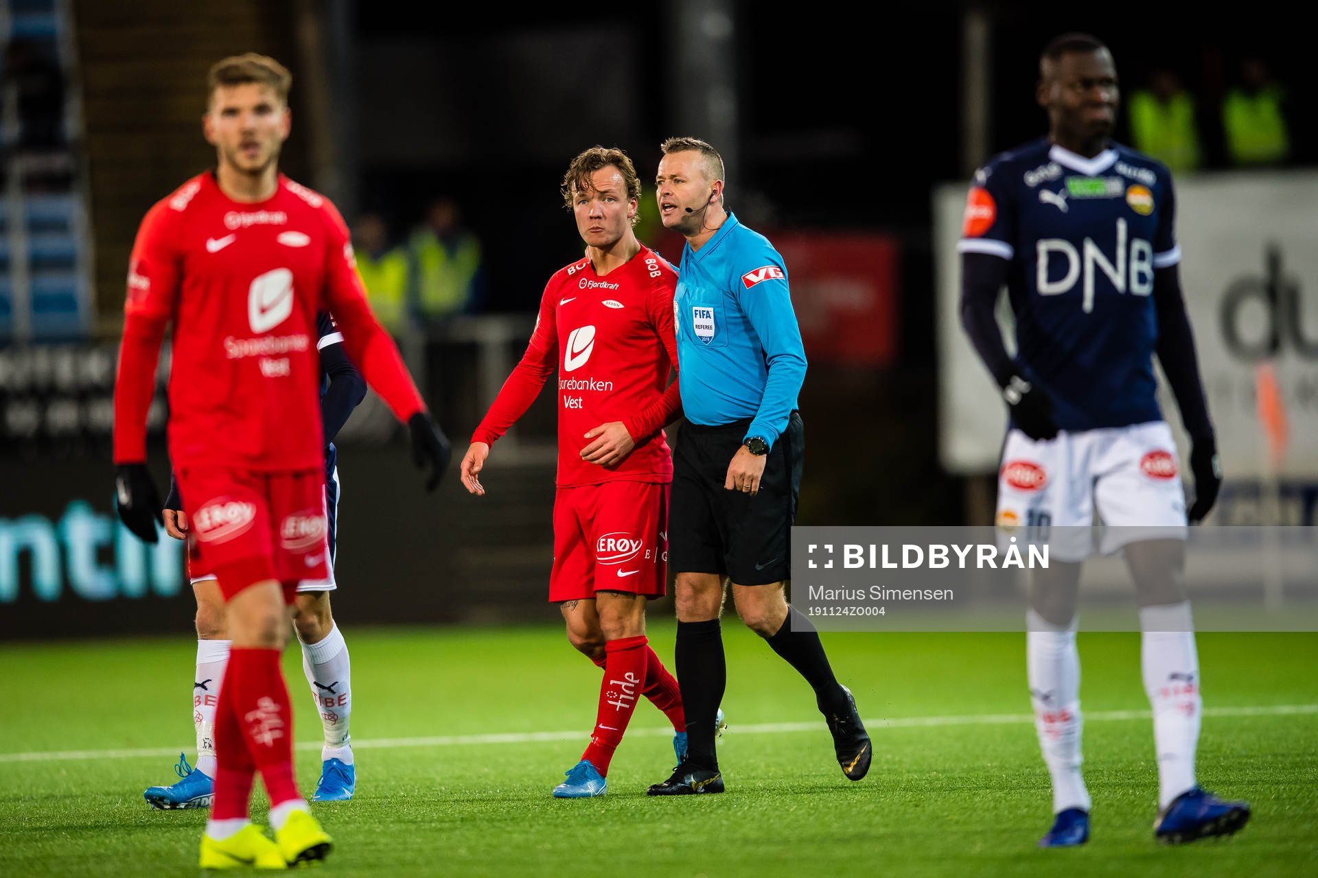 Fredrik Haugen of Brann and Svein Oddvar Moen, referee