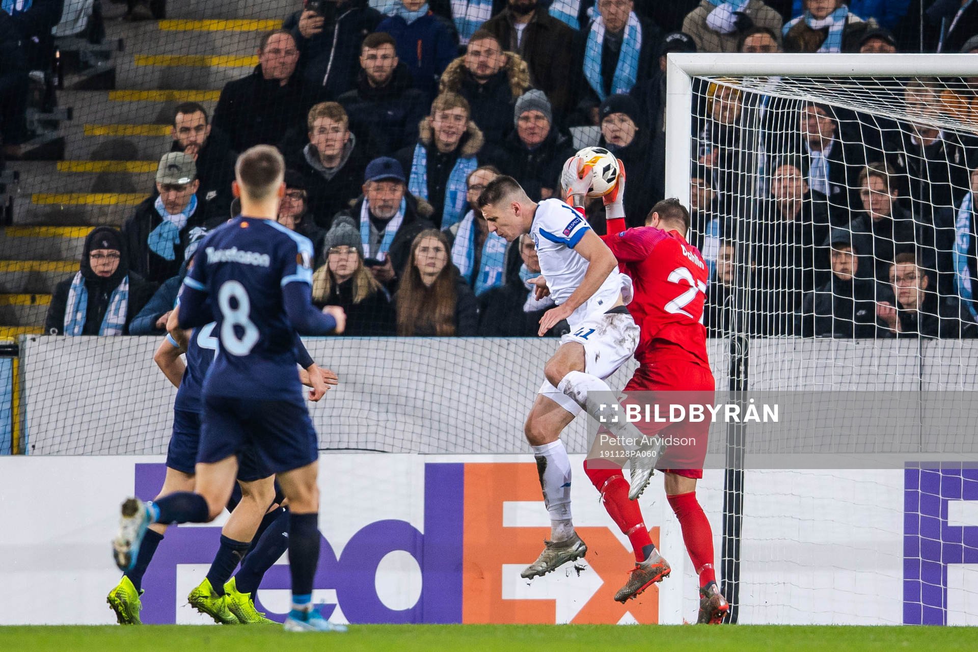 Artem Besedin of Dynamo Kiev tackles goalkeeper Johan