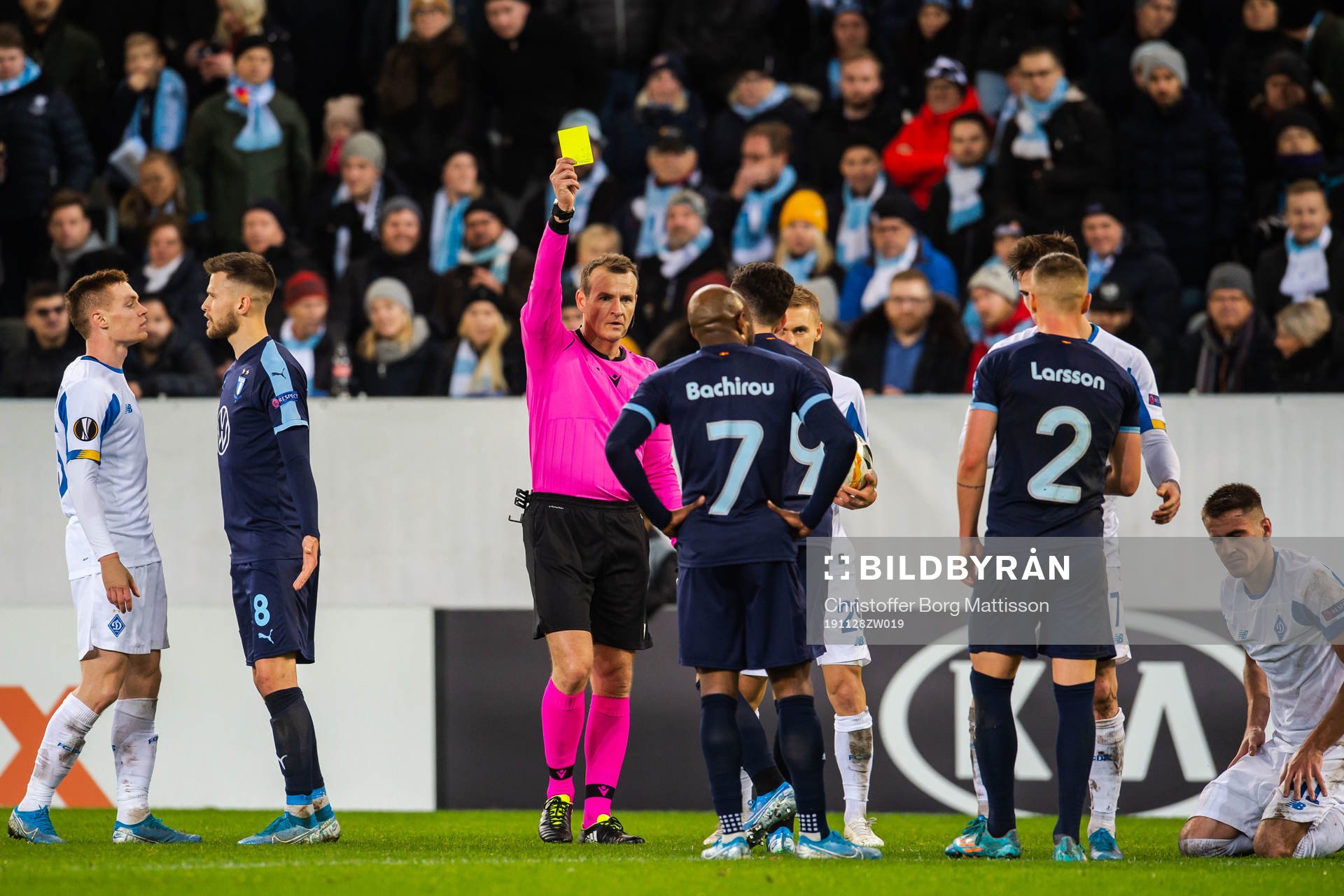 Erdal Rakip of Malmö FF is shown a yellow card by referee