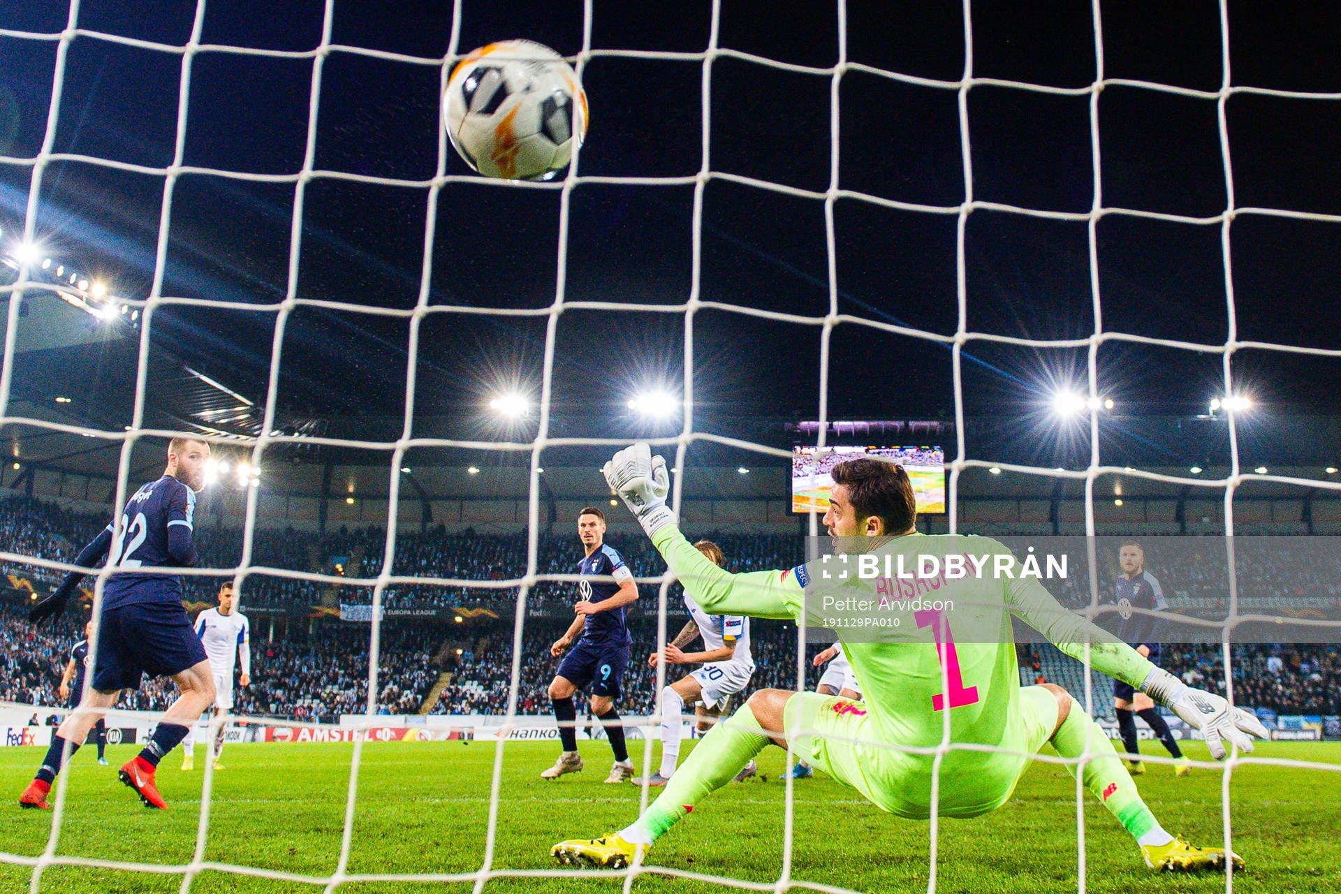 Markus Rosenberg of Malmö FF scores 2-2 behind goalkeeper