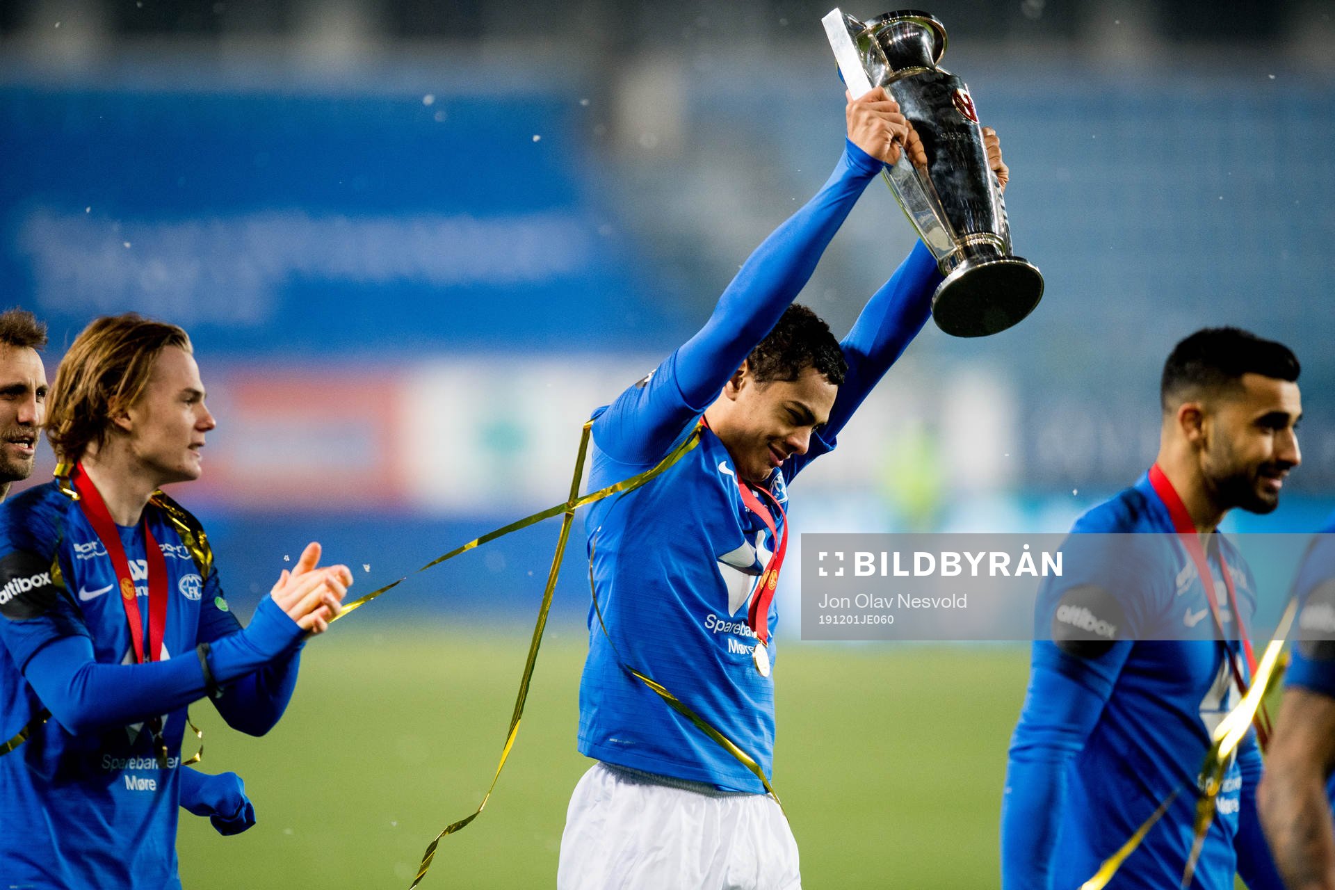 Henry Wingo of Molde celebrates with the trophy