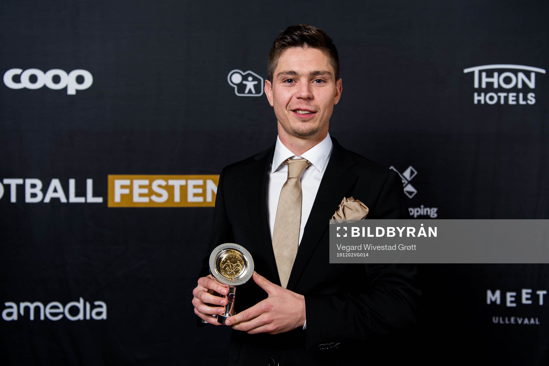 Torgeir Børven of Odd poses for a portrait with the award