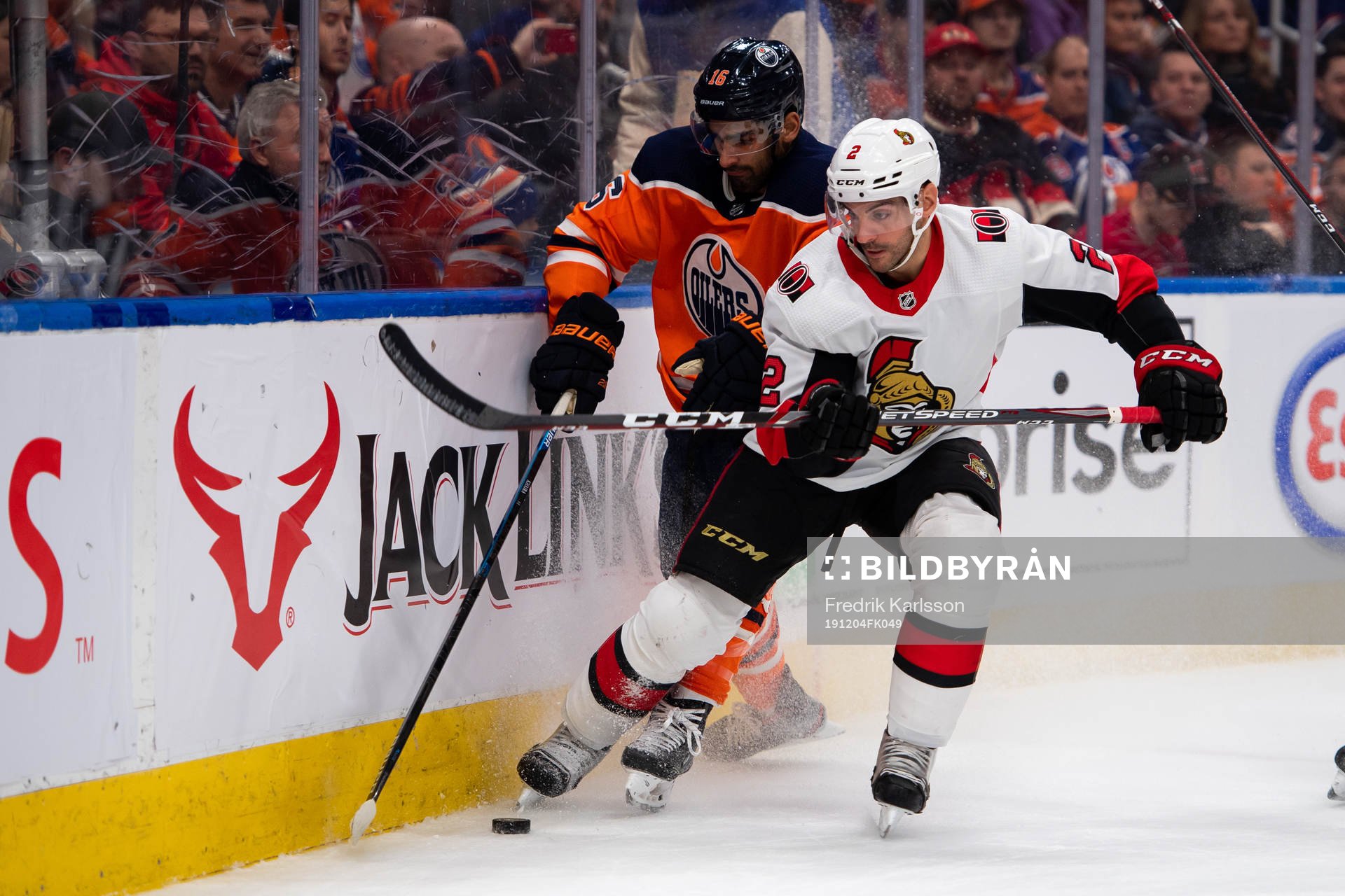 Jujhar Khaira of the Edmonton Oilers and Dylan DeMelo of