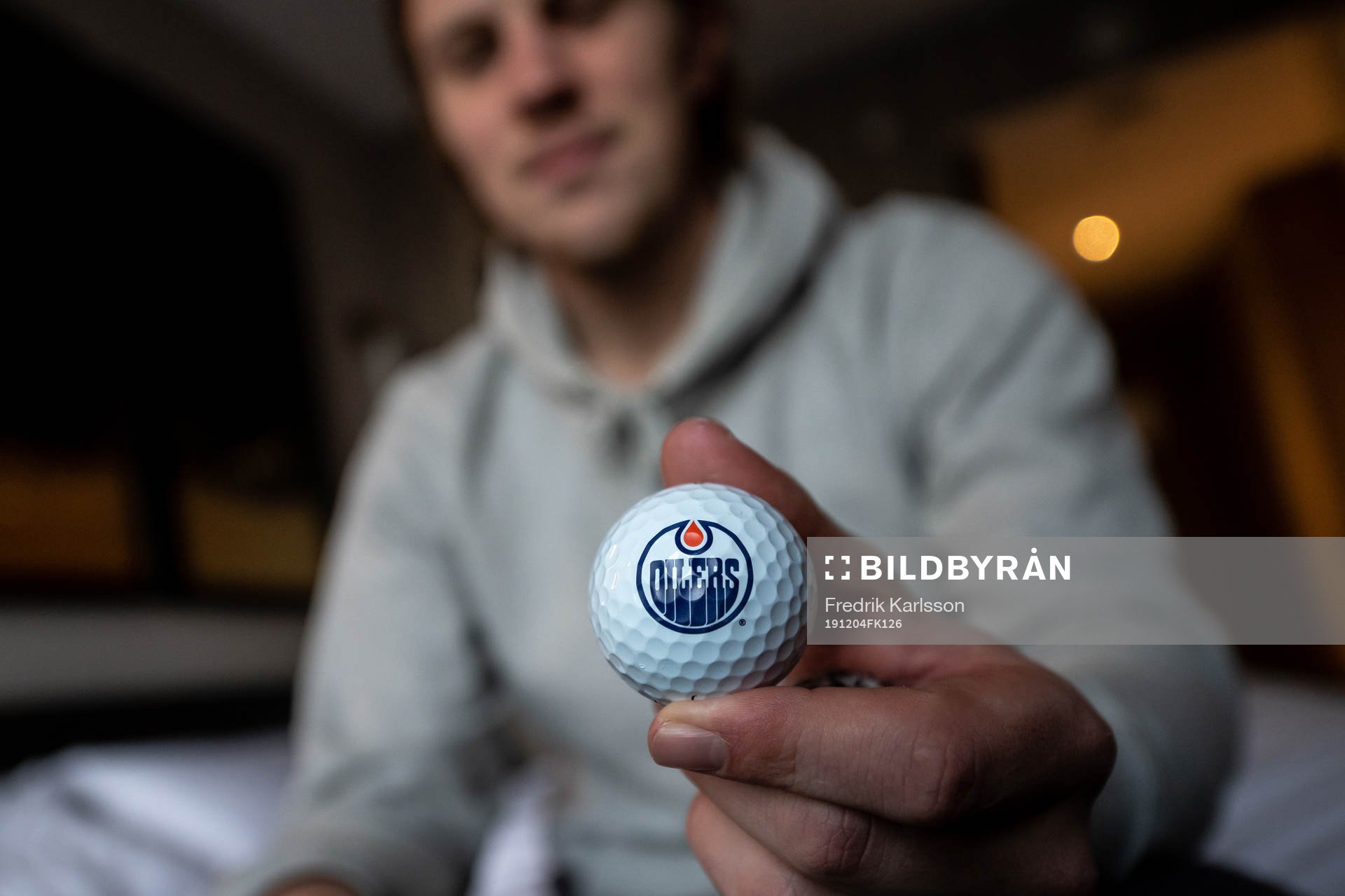 Joel Persson of the Edmonton Oilers with a golfball with