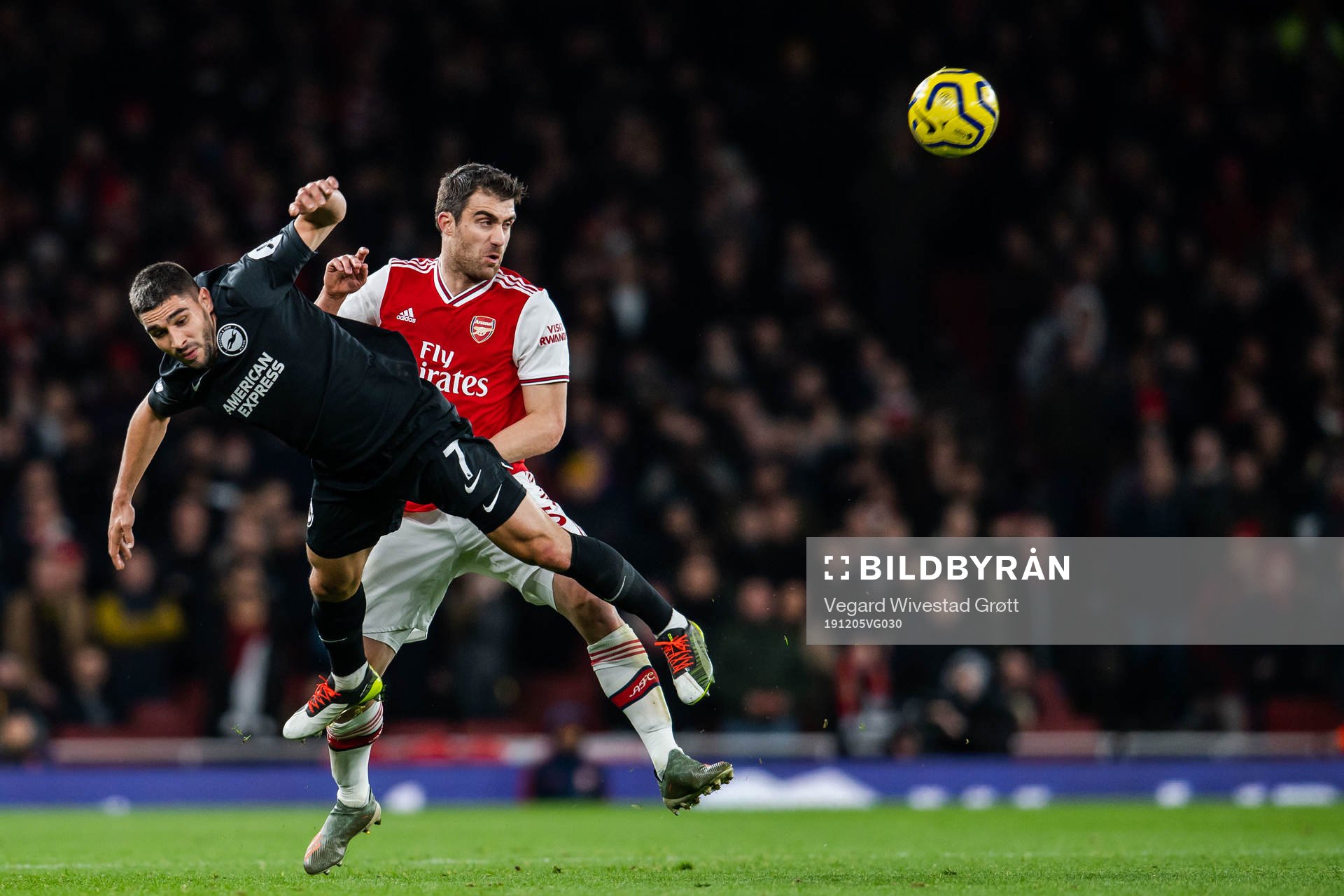 Neal Maupay of Brighton and Sokratis of Arsenal