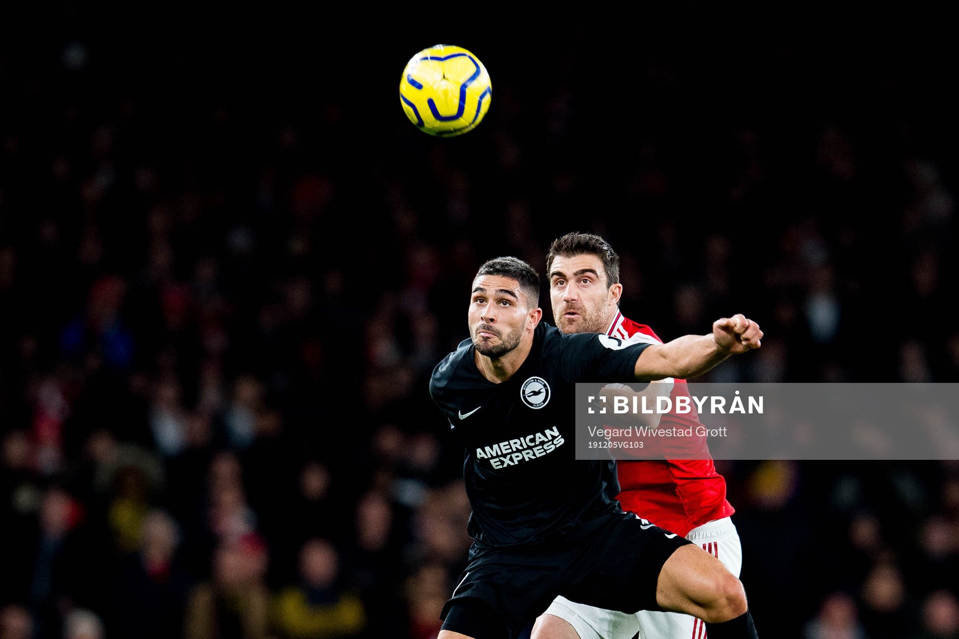 Neal Maupay of Brighton and Sokratis of Arsenal