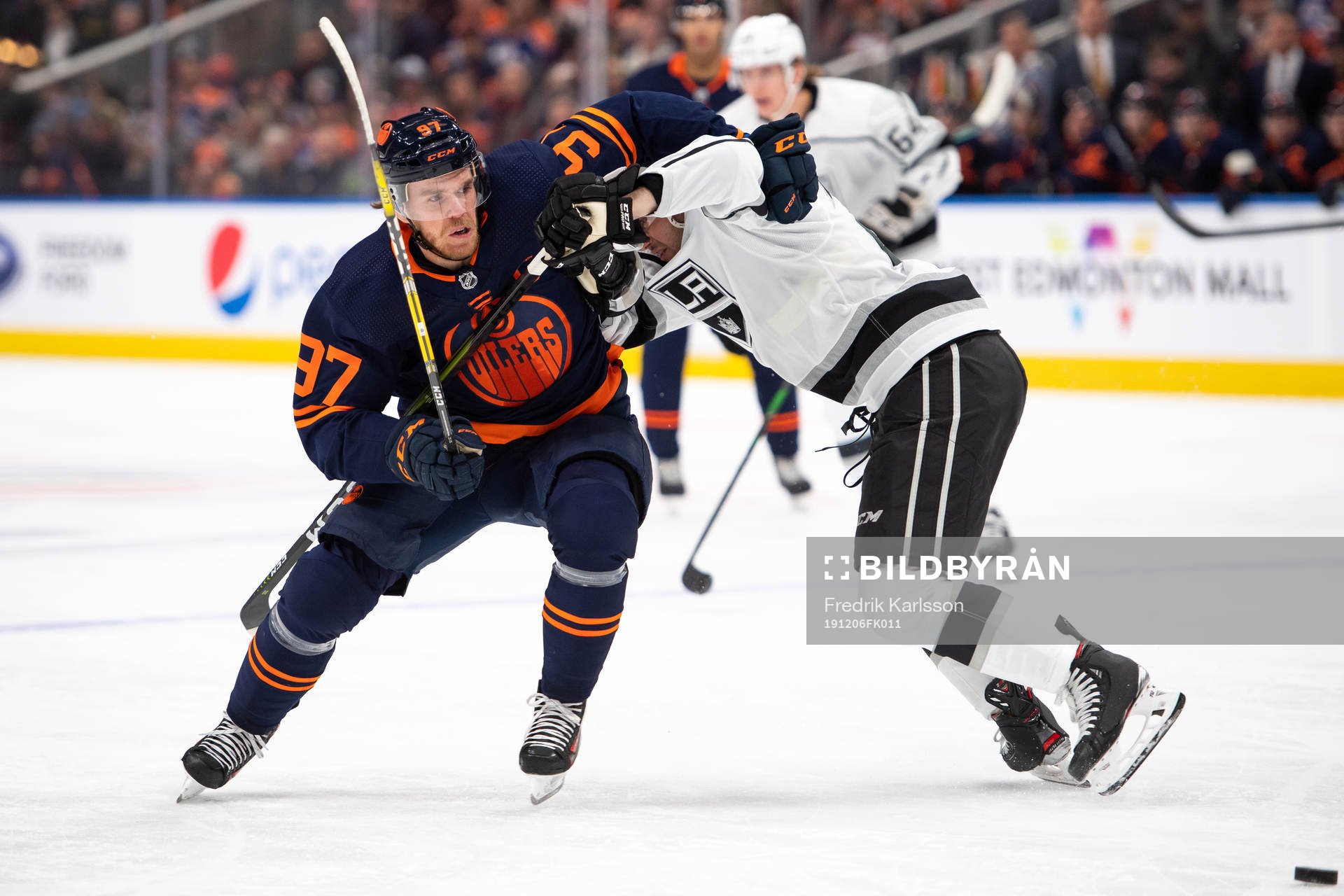 Connor McDavid of the Edmonton Oilers and Sean Walker of