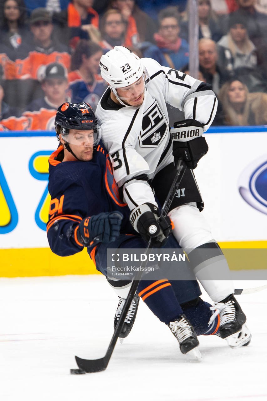 Gaetan Haas of the Edmonton Oilers and Dustin Brown of the