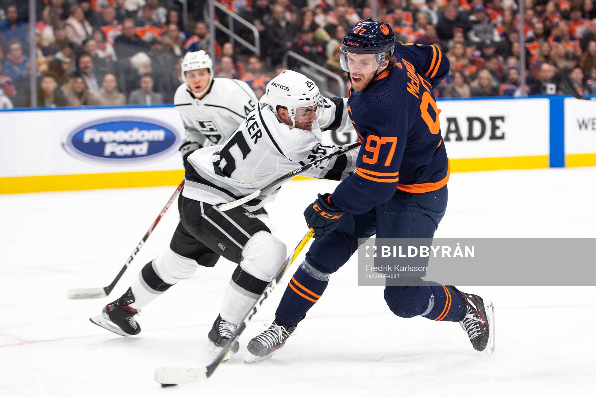 Sean Walker of the Los Angeles Kings and Connor McDavid of