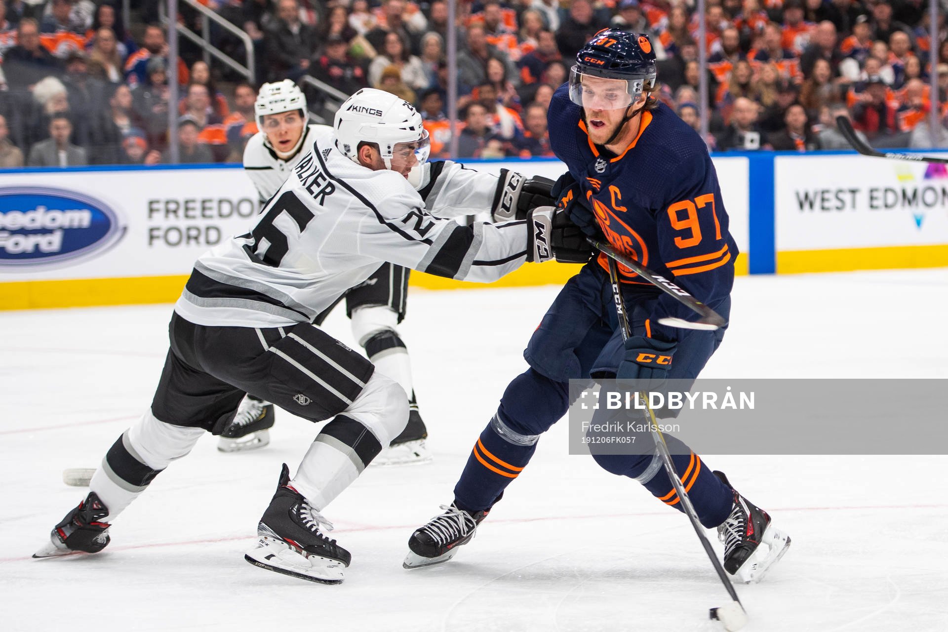 Sean Walker of the Los Angeles Kings and Connor McDavid of