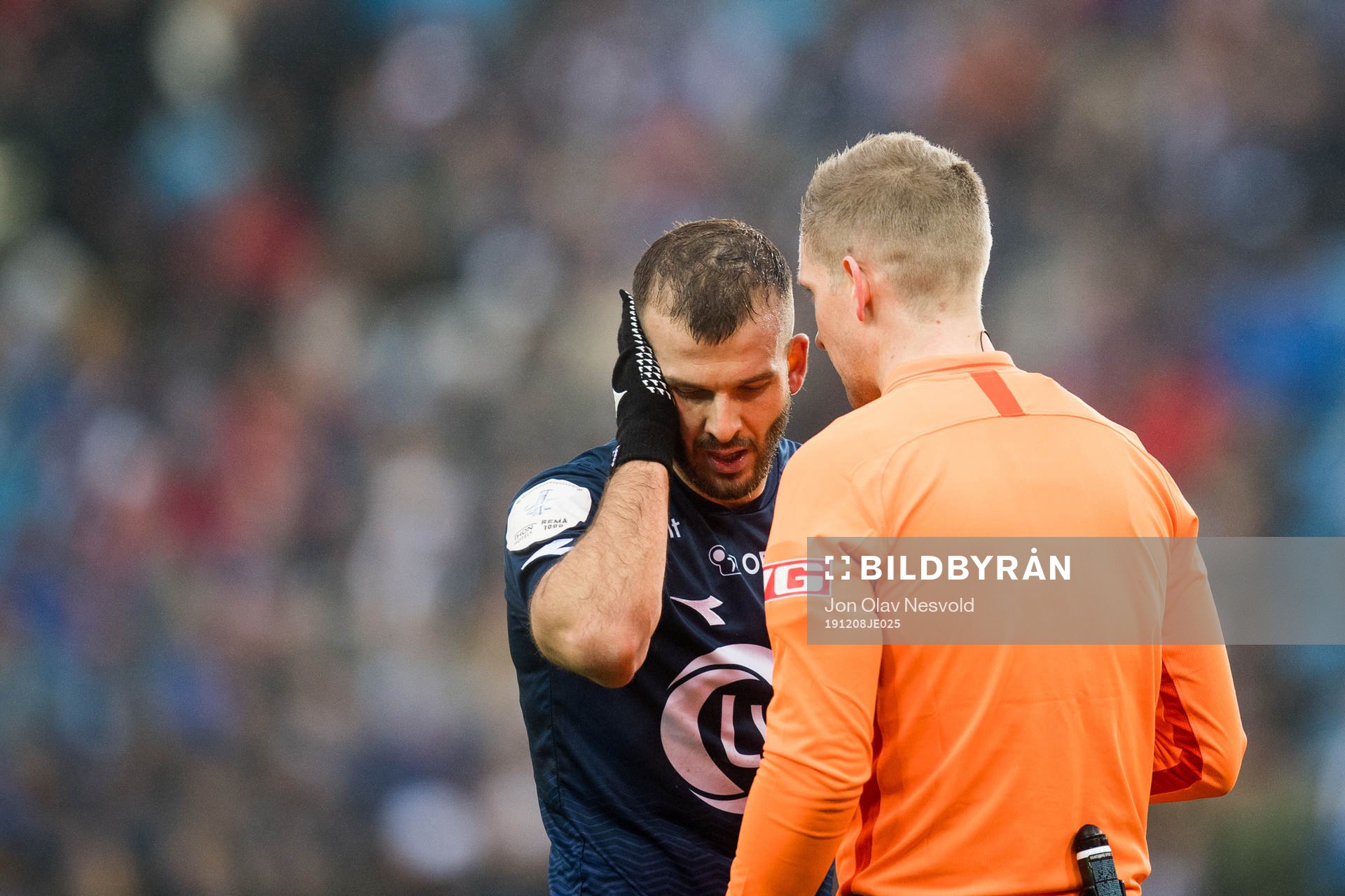 Zlatko Tripic of Viking and Espen Andreas Eskås, referee