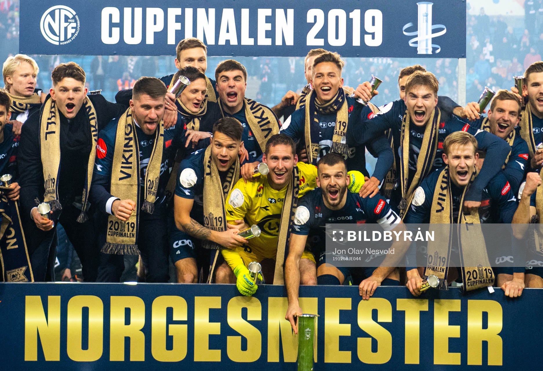 Players of Viking celebrate with the trophy