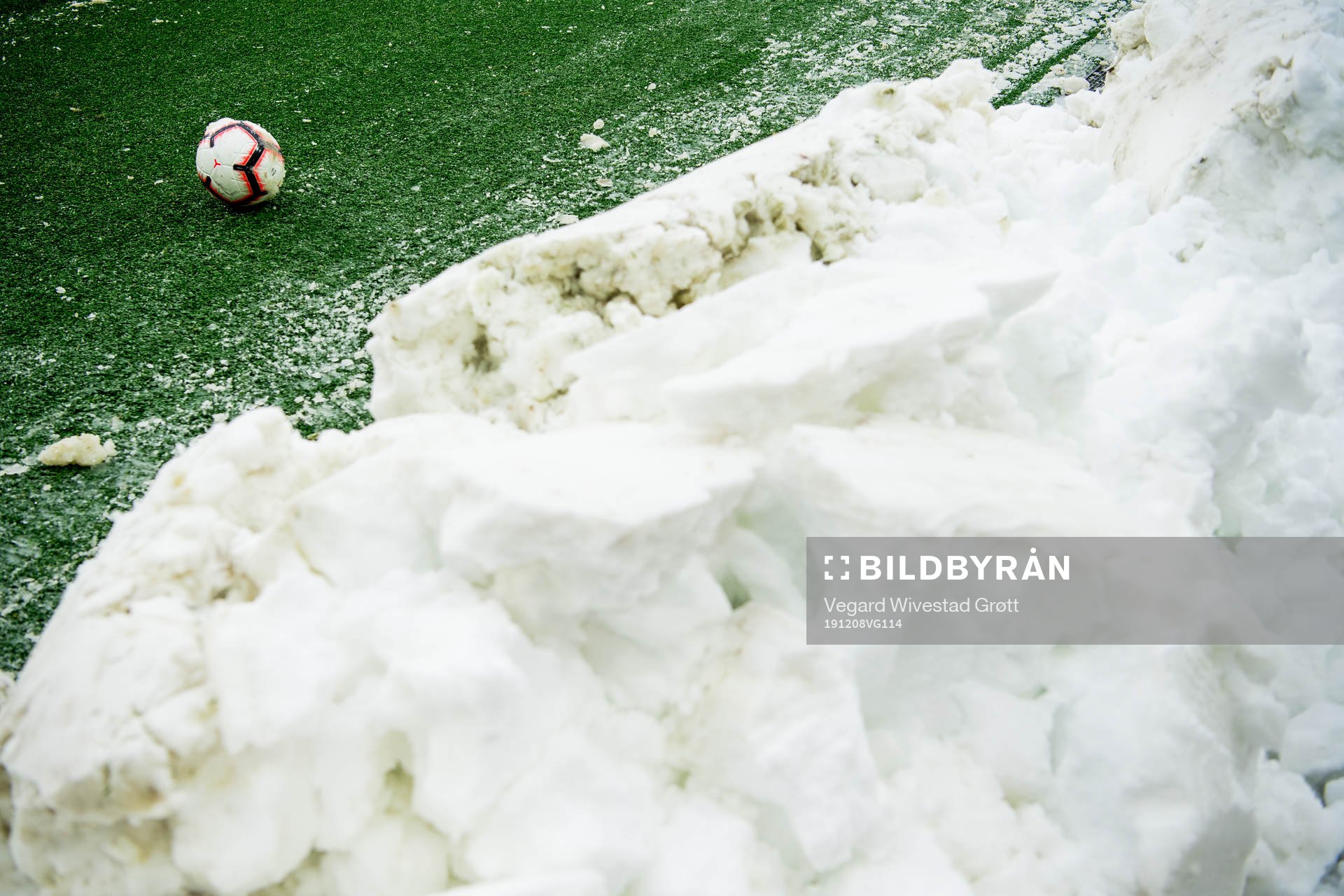 The official match ball next to the snow