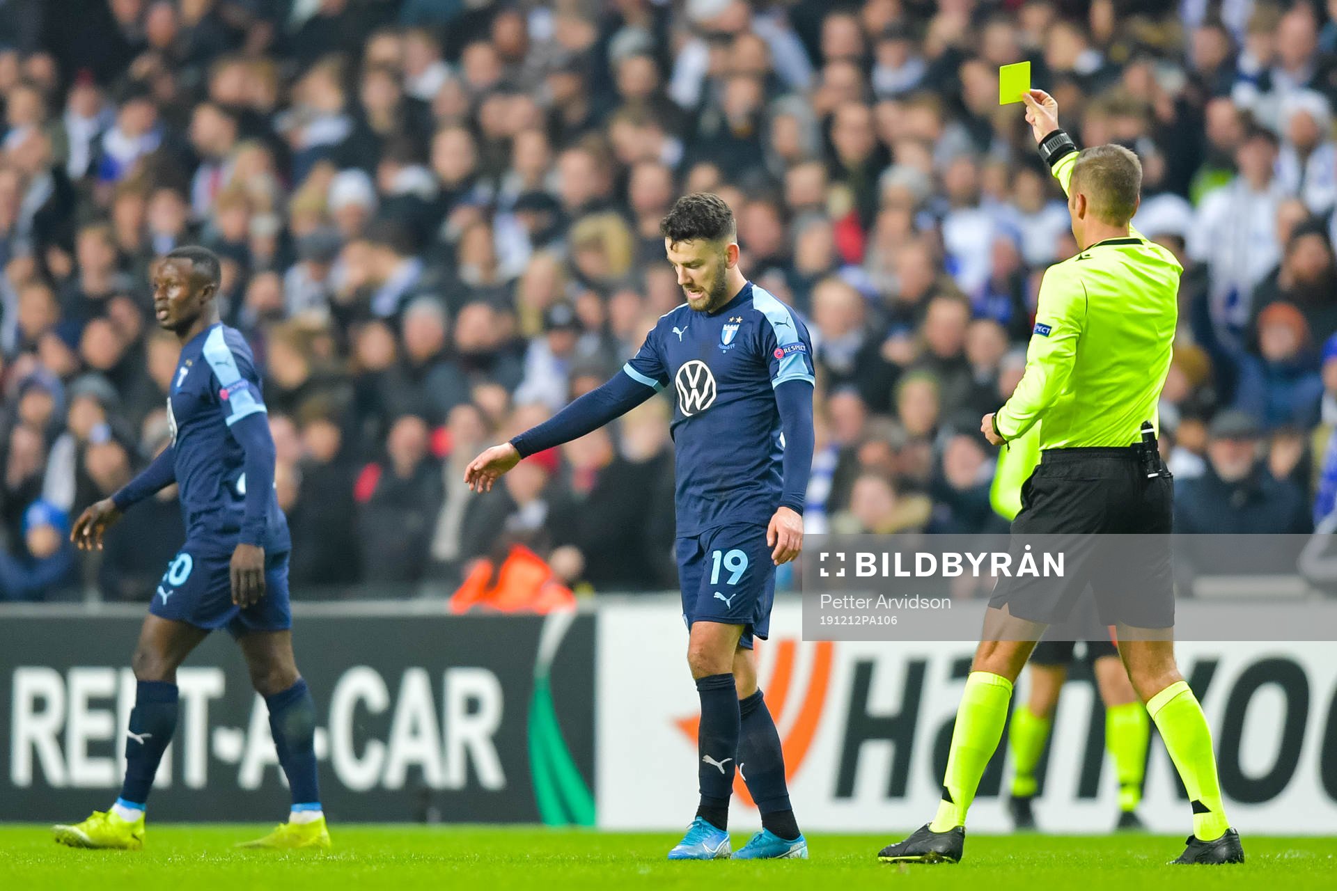 Erdal Rakip of Malmö FF receives a yellow card from
