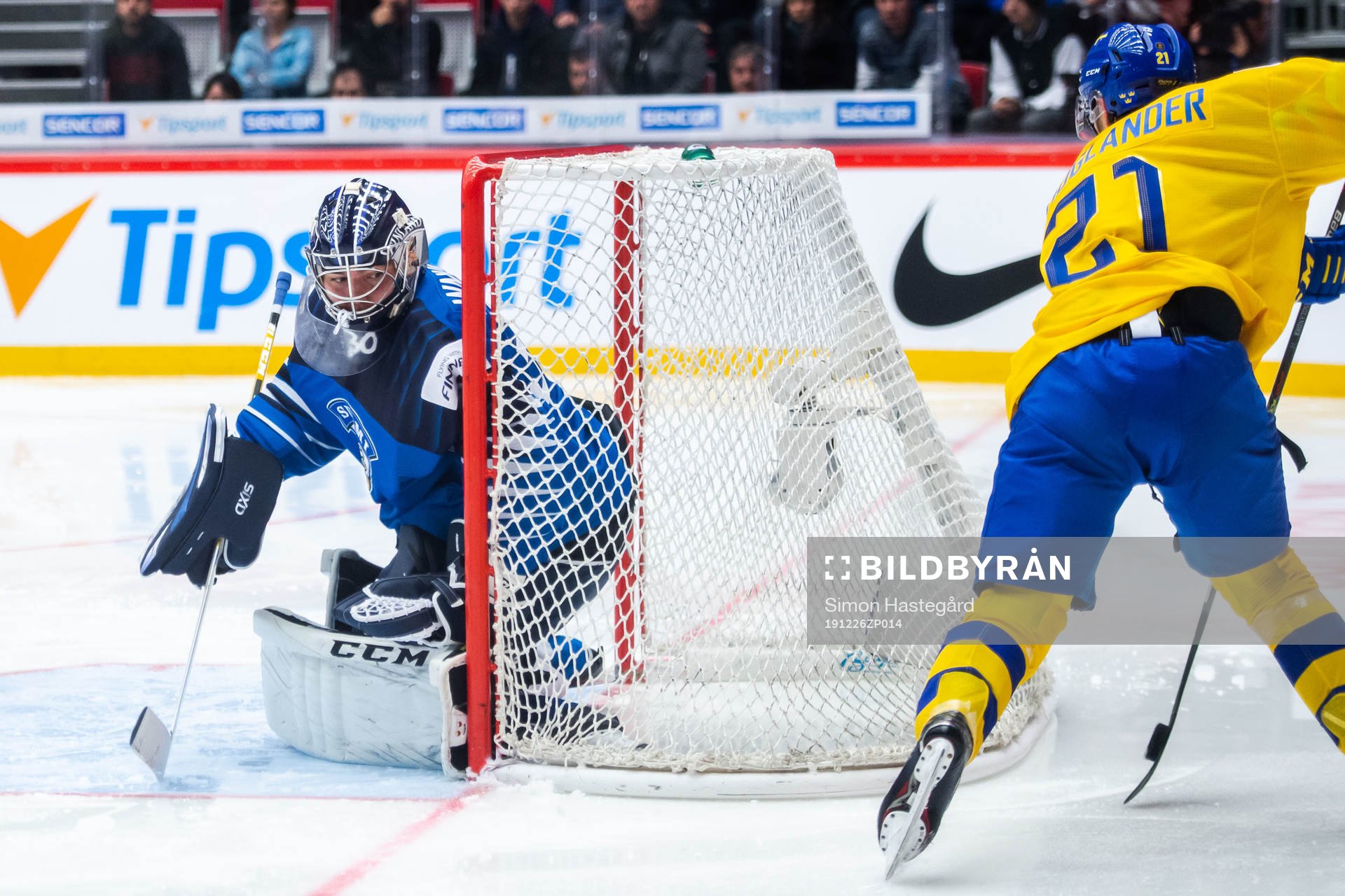 Nils Höglander of Sweden scores 1-1 behind goalkeeper