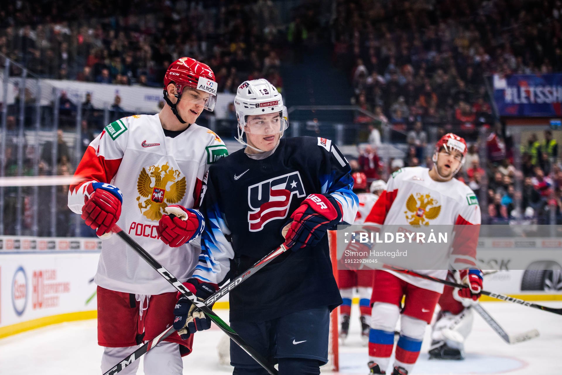 Danil Zhuravlyov of Russia and Cole Caufield of USA
