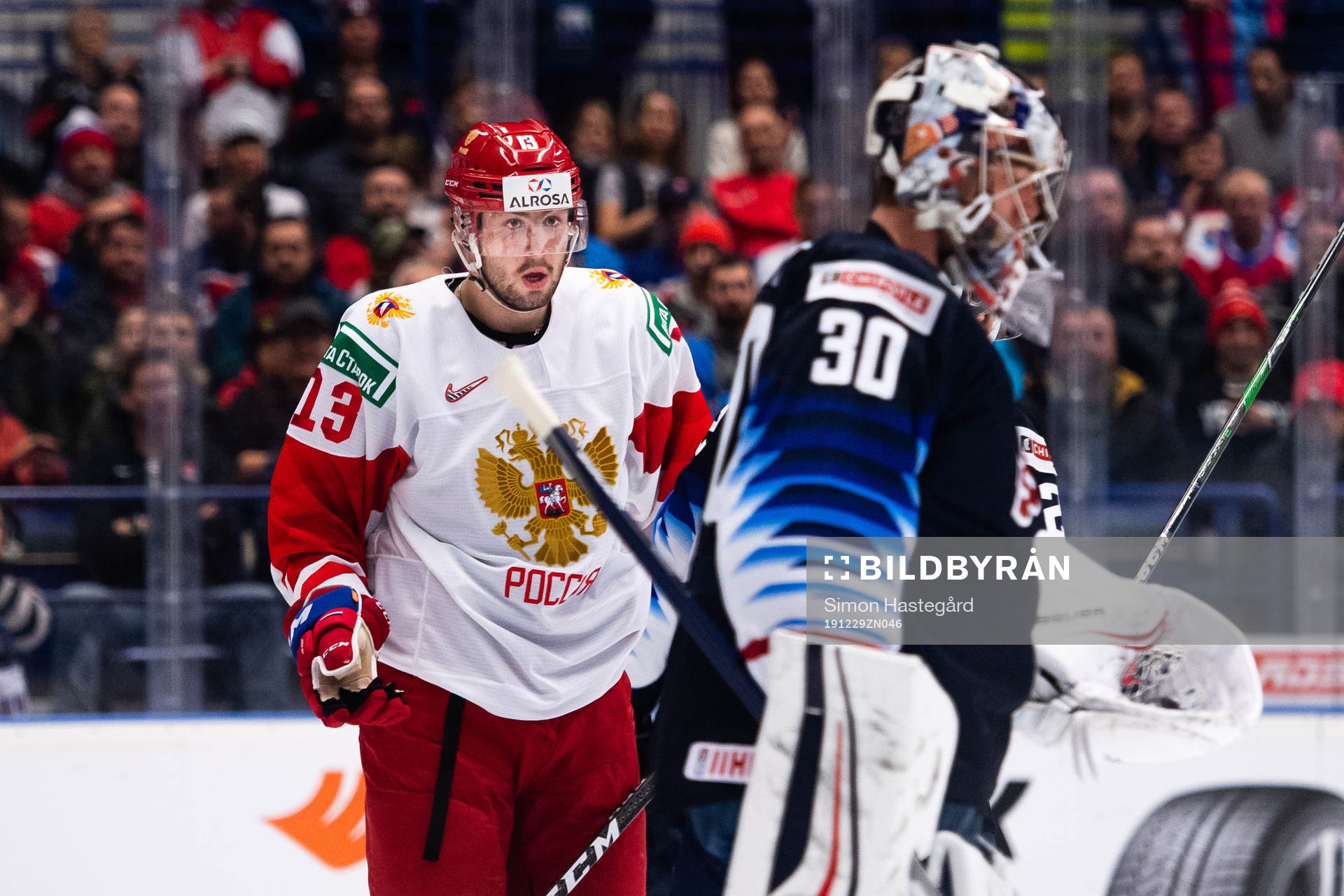 Grigori Denisenko of Russia and Goalkeeper Spencer Knight