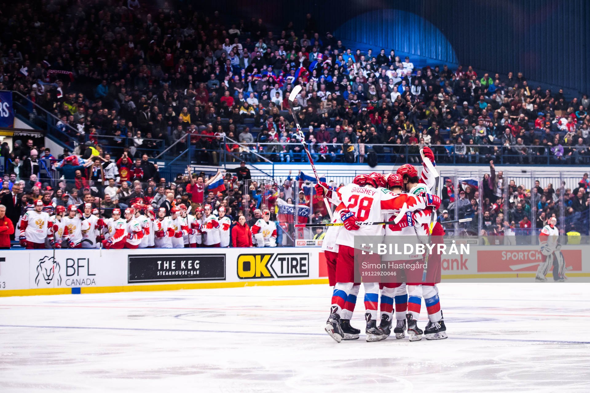 Alexander Romanov of Russia celebrate with teammates
