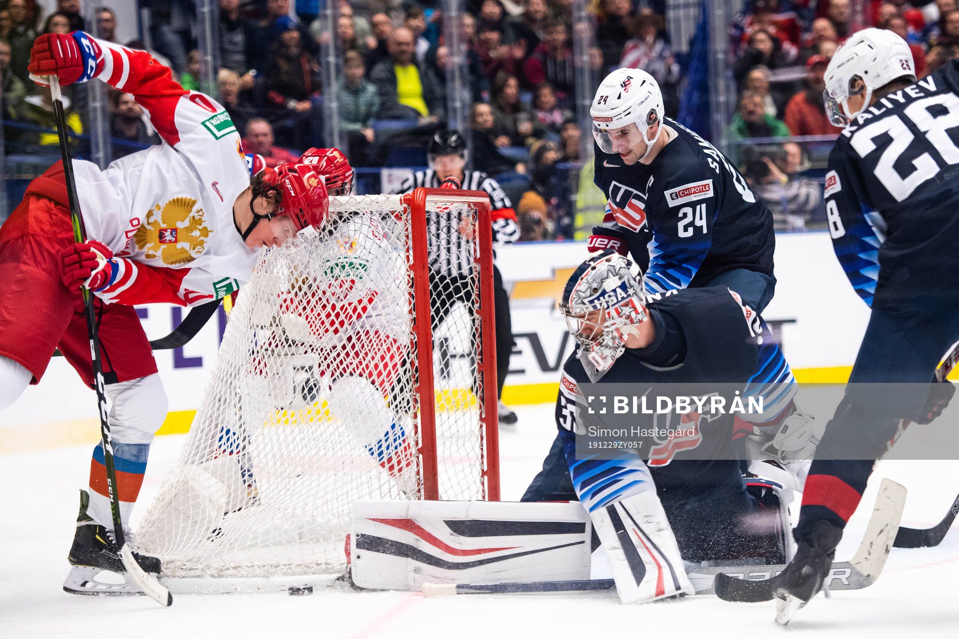 Dmitri Voronkov of Russia against goalkeeper Spencer Knight