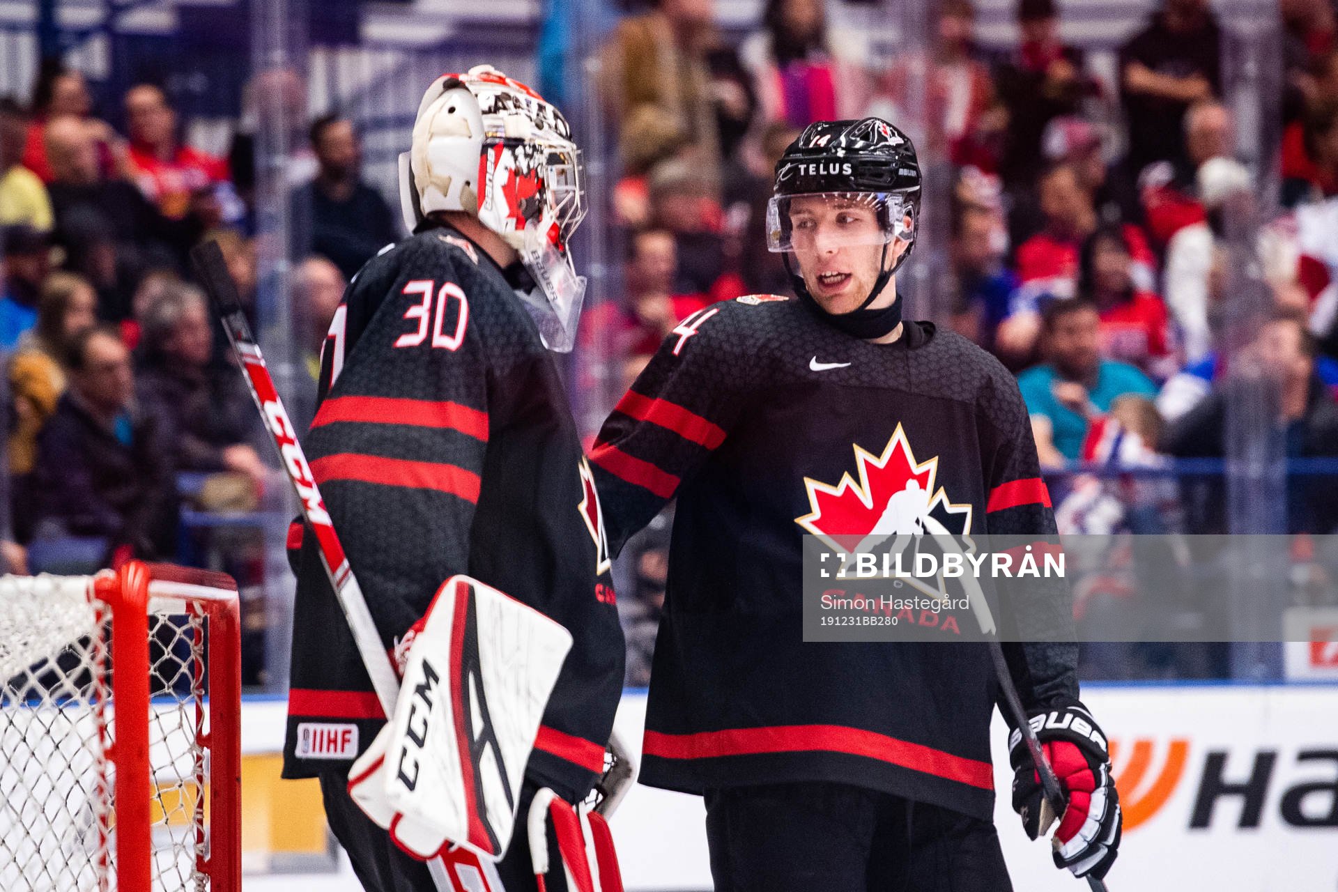 Goalkeeper Joel Hofer and Jared McIsaac of Canada