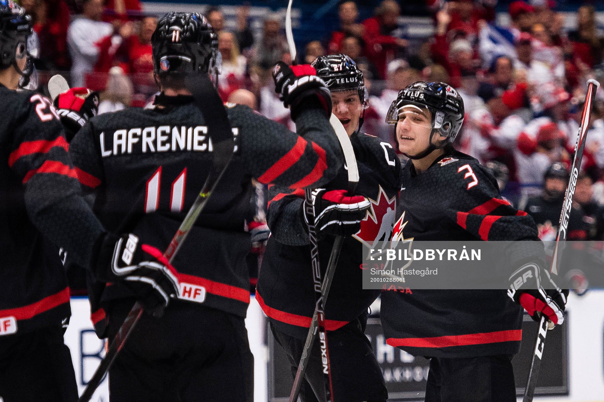 Barrett Hayton and Calen Addison of Canada celebrate the