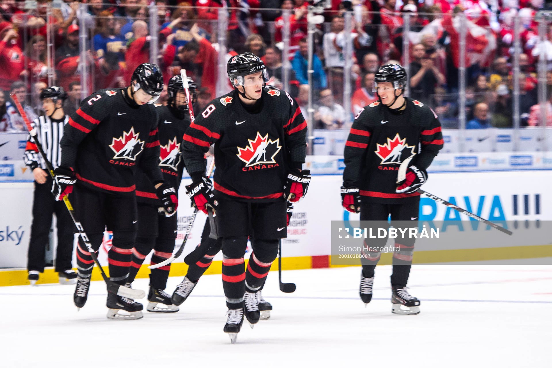 Liam Foudy of Canada celebrate with teammates