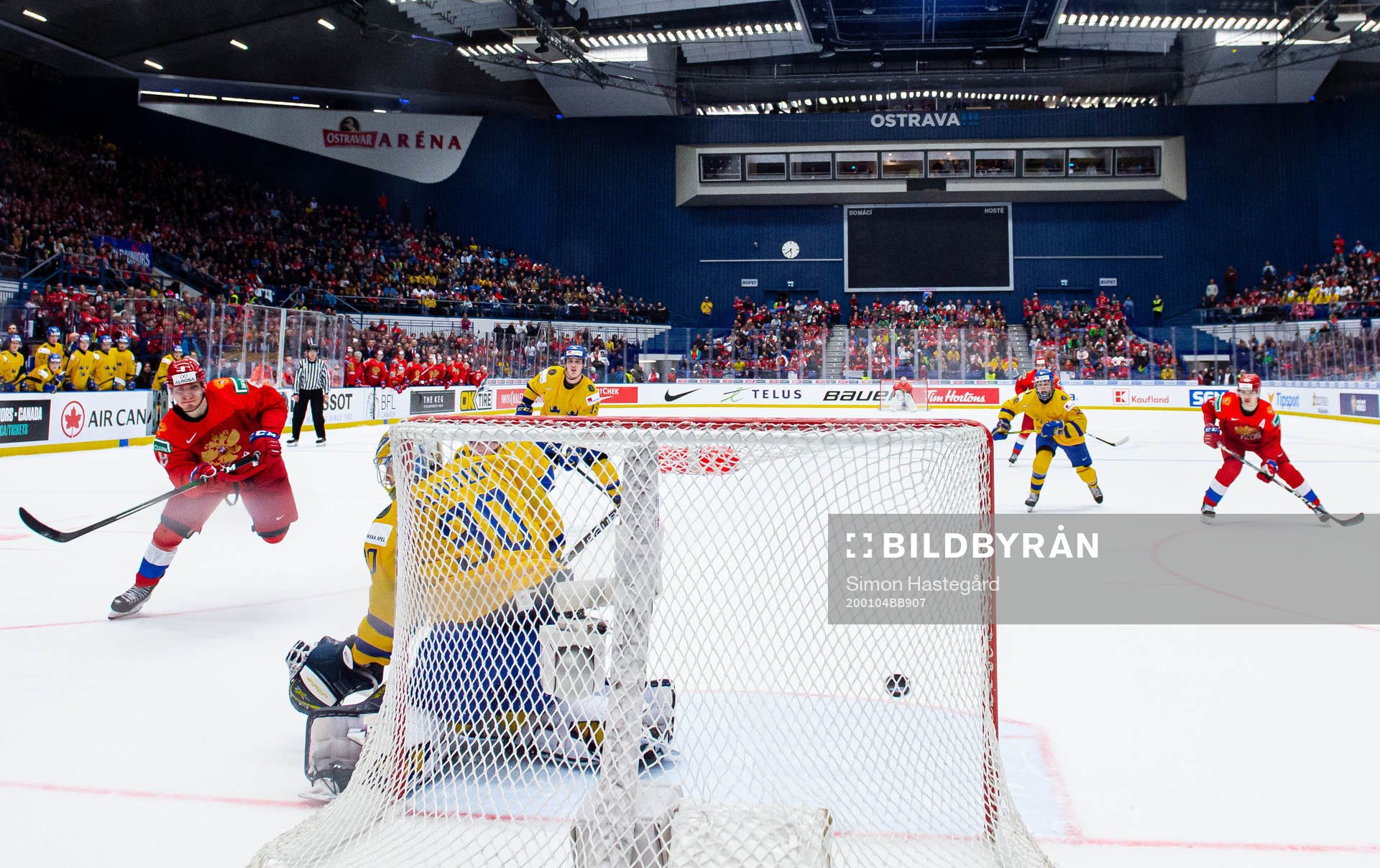 Ivan Morozov of Russia scores 4-5 behind goalkeeper Hugo