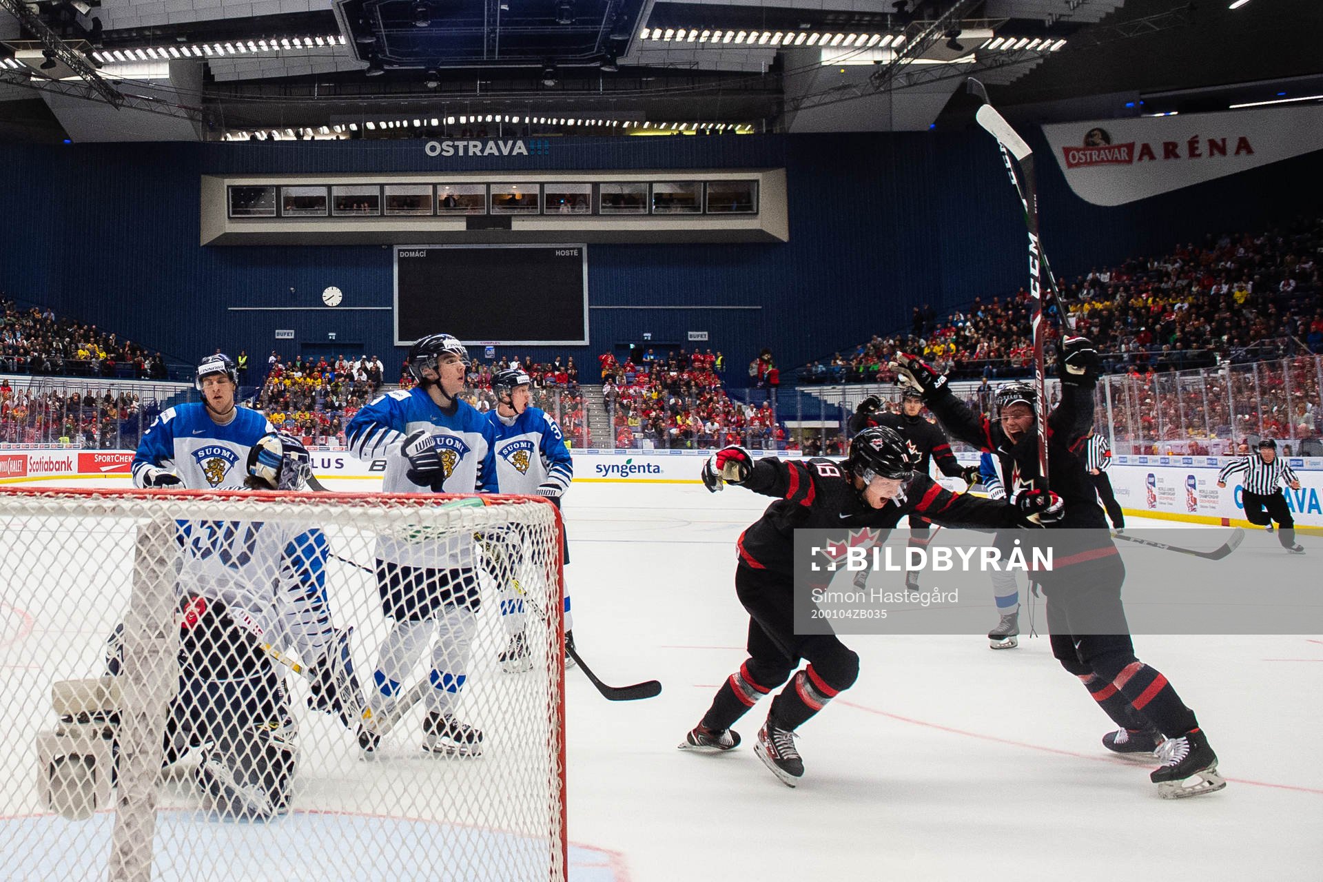 Aidan Dudas and Ty Dellandrea of Canada celebrate the 4-0
