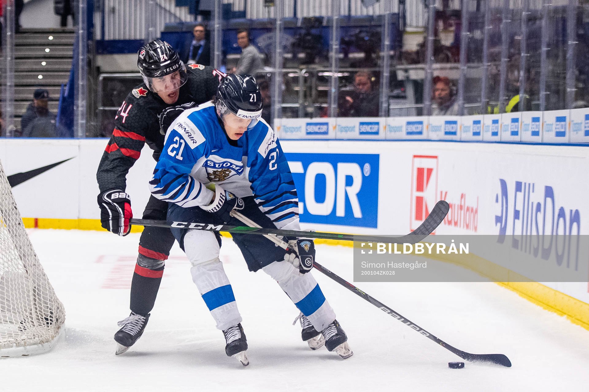 Ty Smith of Canada and Patrik Puistola of Finland
