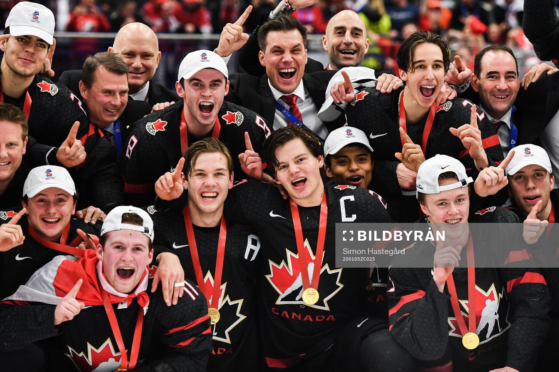Alexis Lafreniere of Canada celebrate with teammates