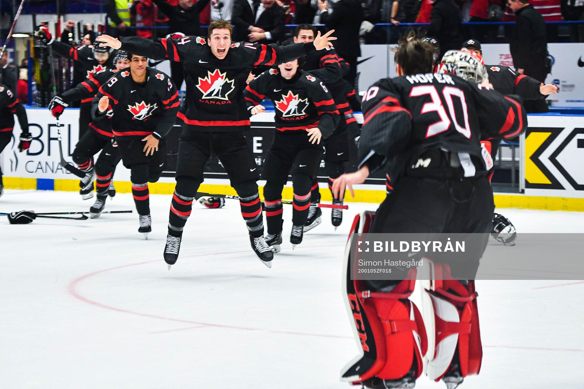 Jared McIsaac celebrate with goalkeeper Joel Hofer of Canada