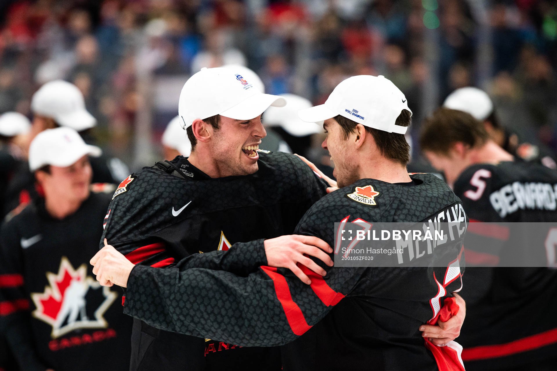 Liam Foudy and Connor McMichael of Canada celebrate