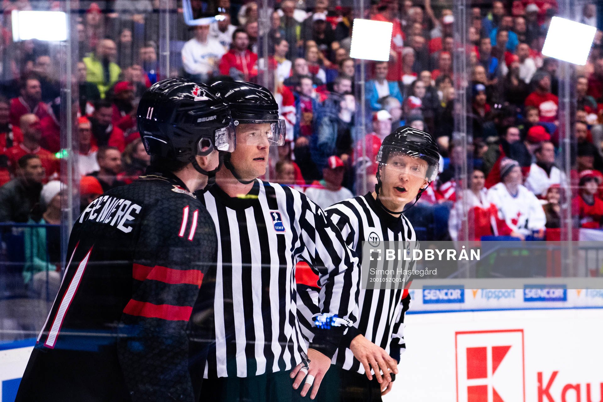 Alexis Lafreniere of Canada talks to Linesman Ludvig