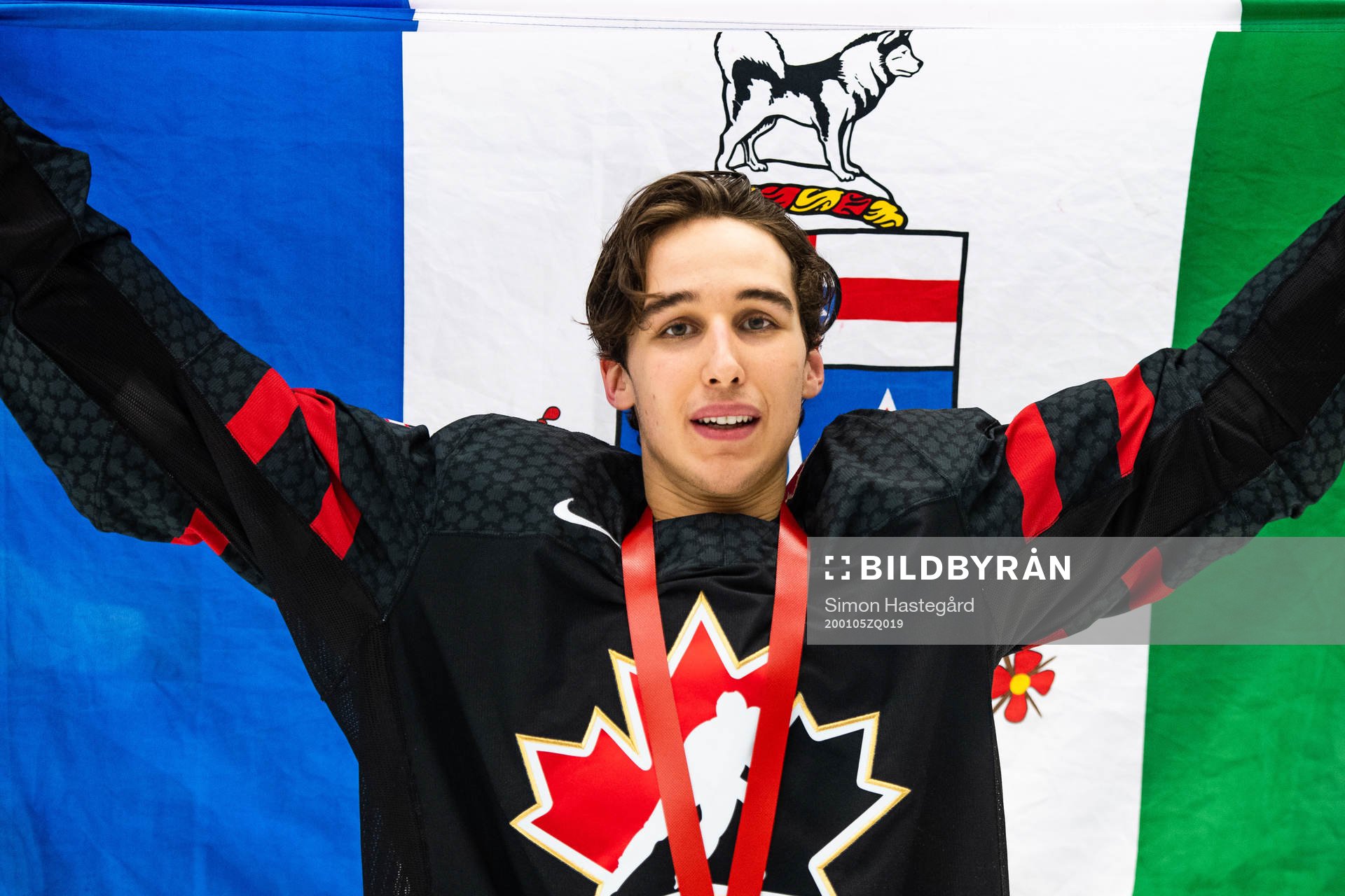 Dylan Cozens of Canada celebrates