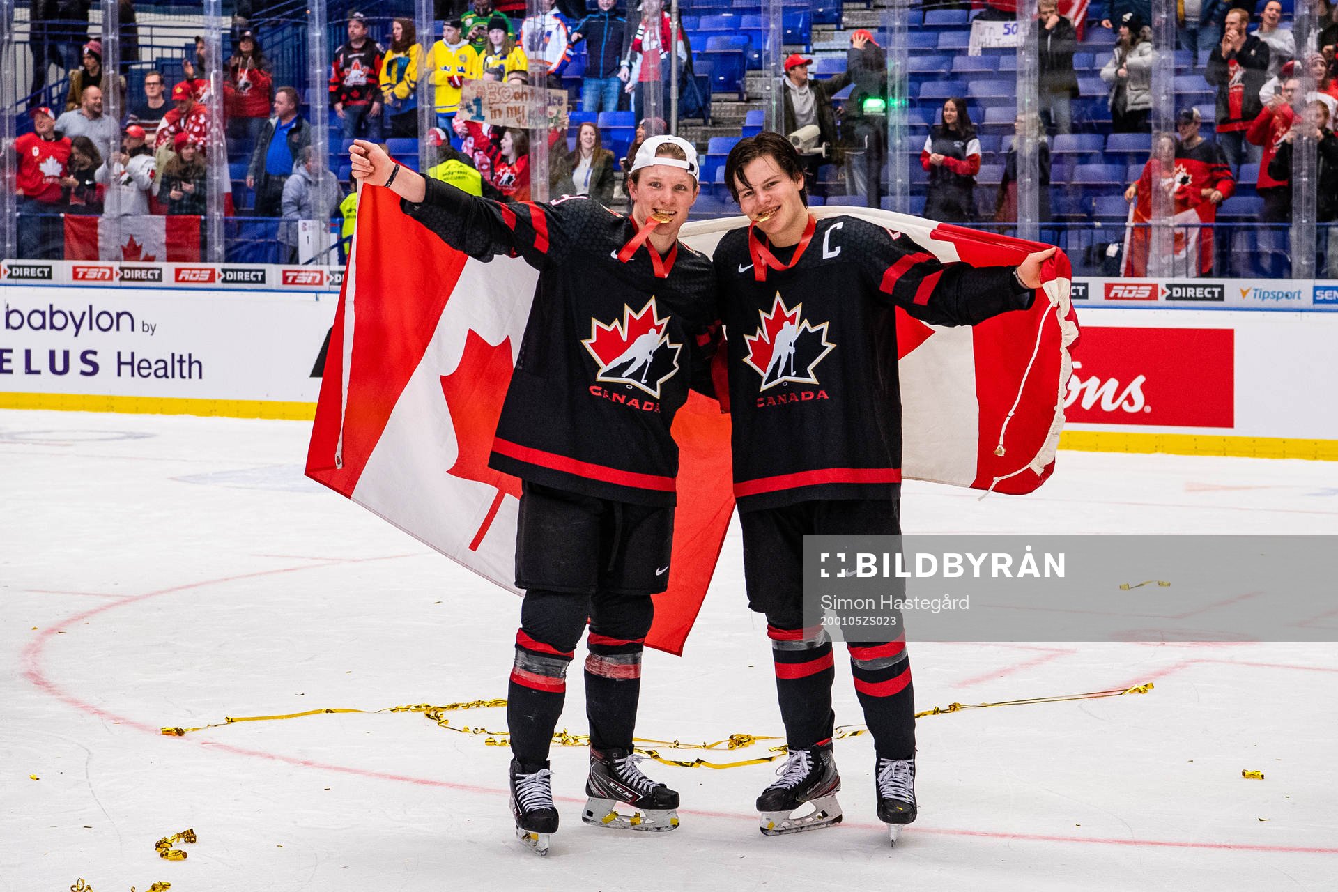 Ty Dellandrea and Barrett Hayton of Canada celebrate