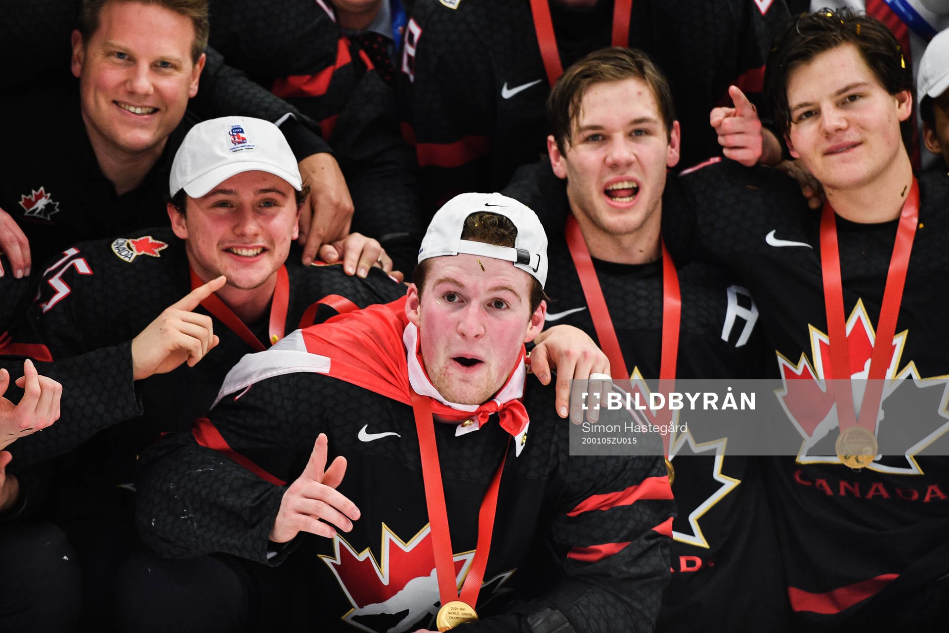 Alexis Lafreniere of Canada celebrate with teammates