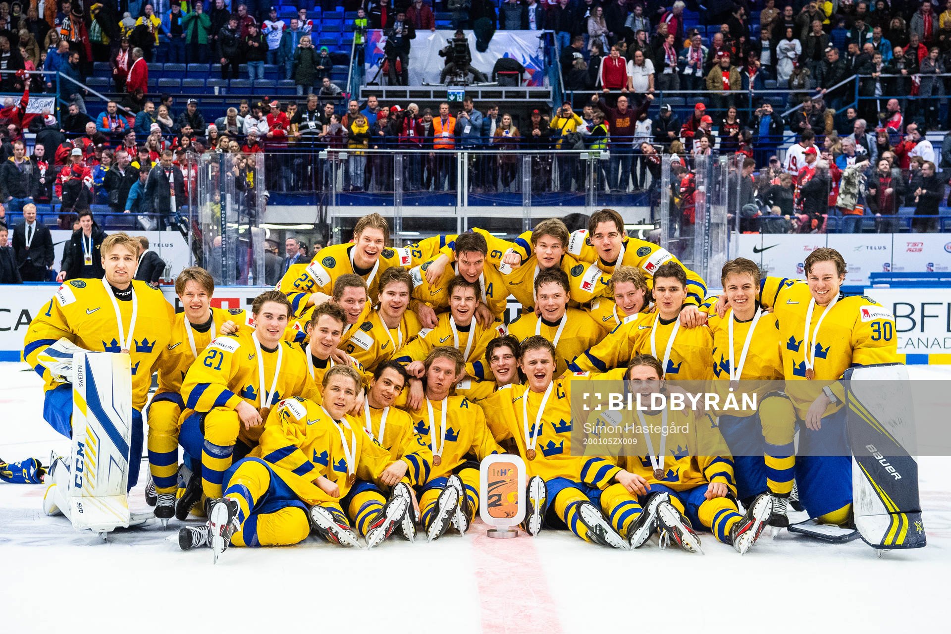Players of Sweden celebrate with the trophy