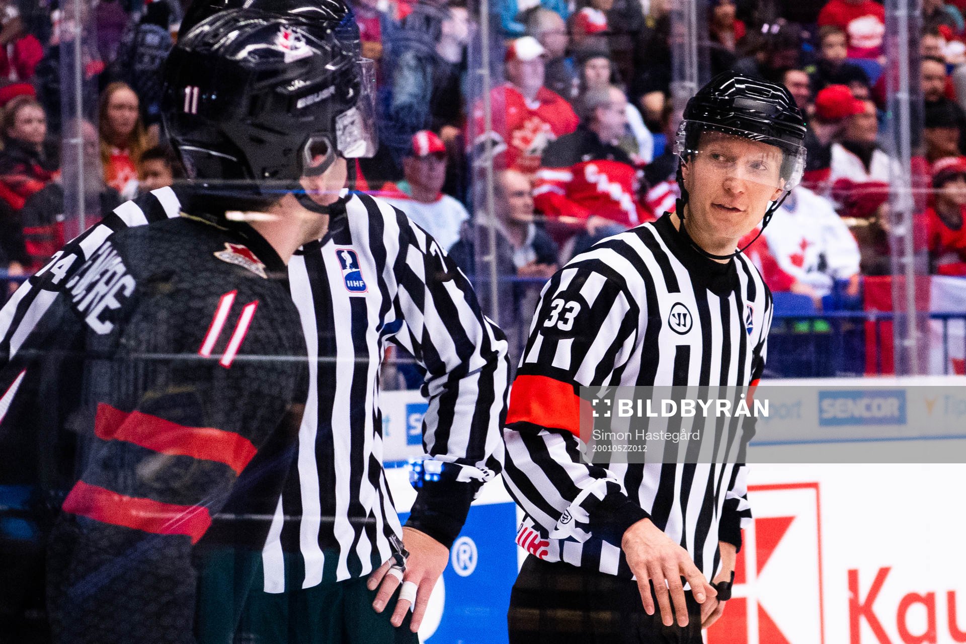 Alexis Lafreniere of Canada referee Kristian Vikman and