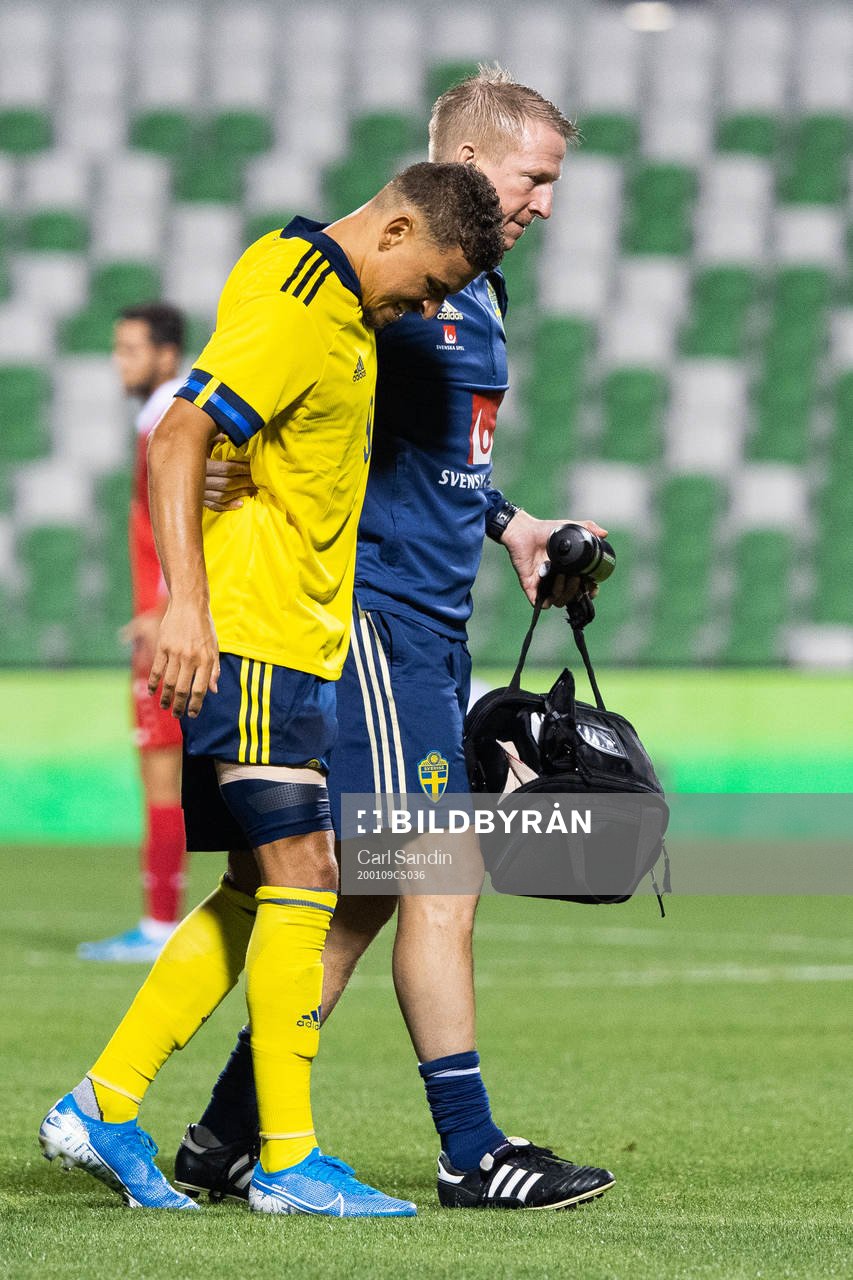 Jordan Larsson of Sweden receives help to leave the pitch