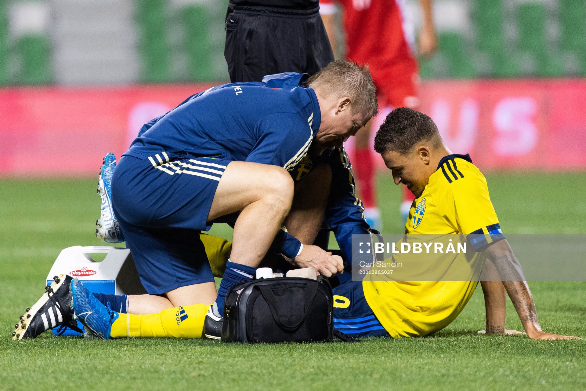 Jordan Larsson of Sweden receives medical attention