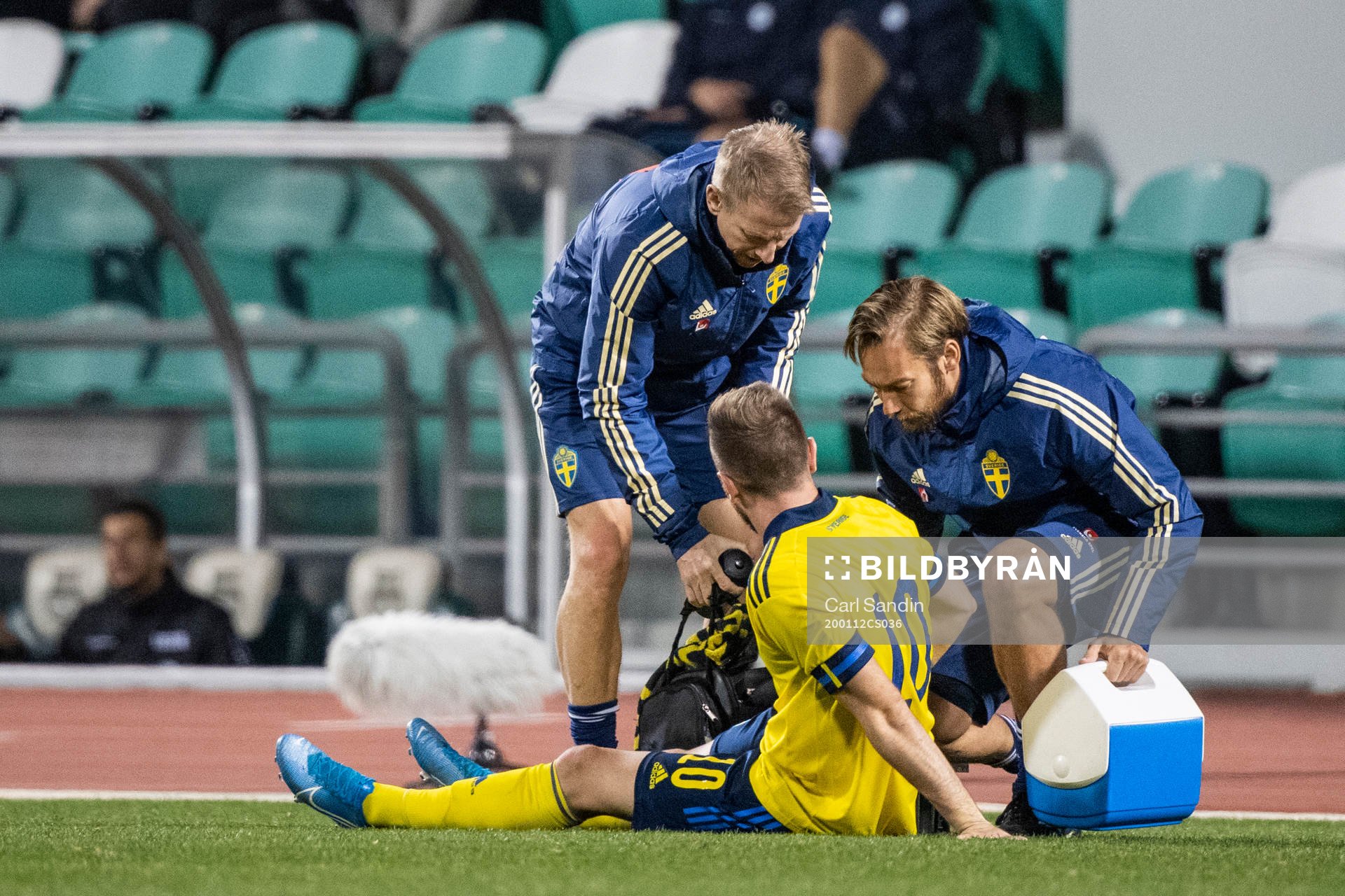 Muamer Tankovic of Sweden receives medical attention