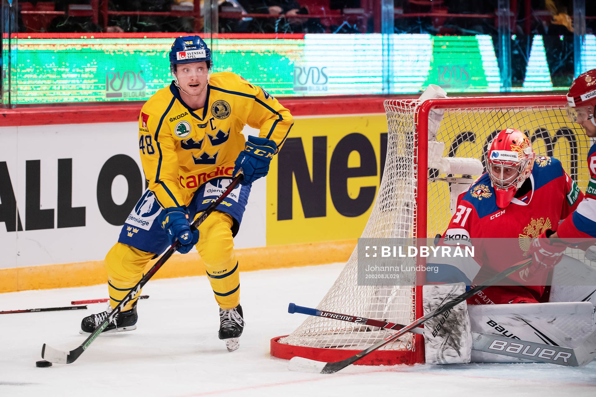 Carl Klingberg of Sweden and goalkeeper Alexander Samonov