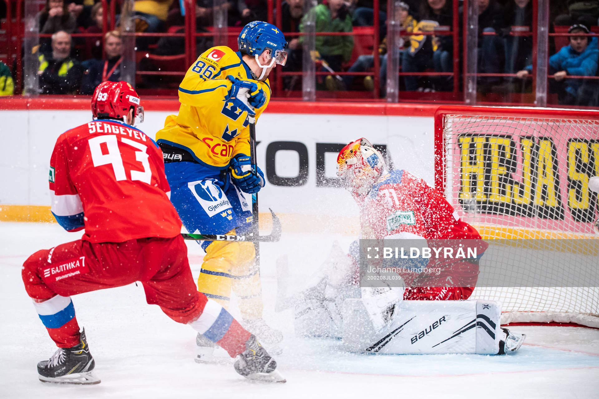 Mathias Bromé of Sweden and goalkeeper Alexander Samonov